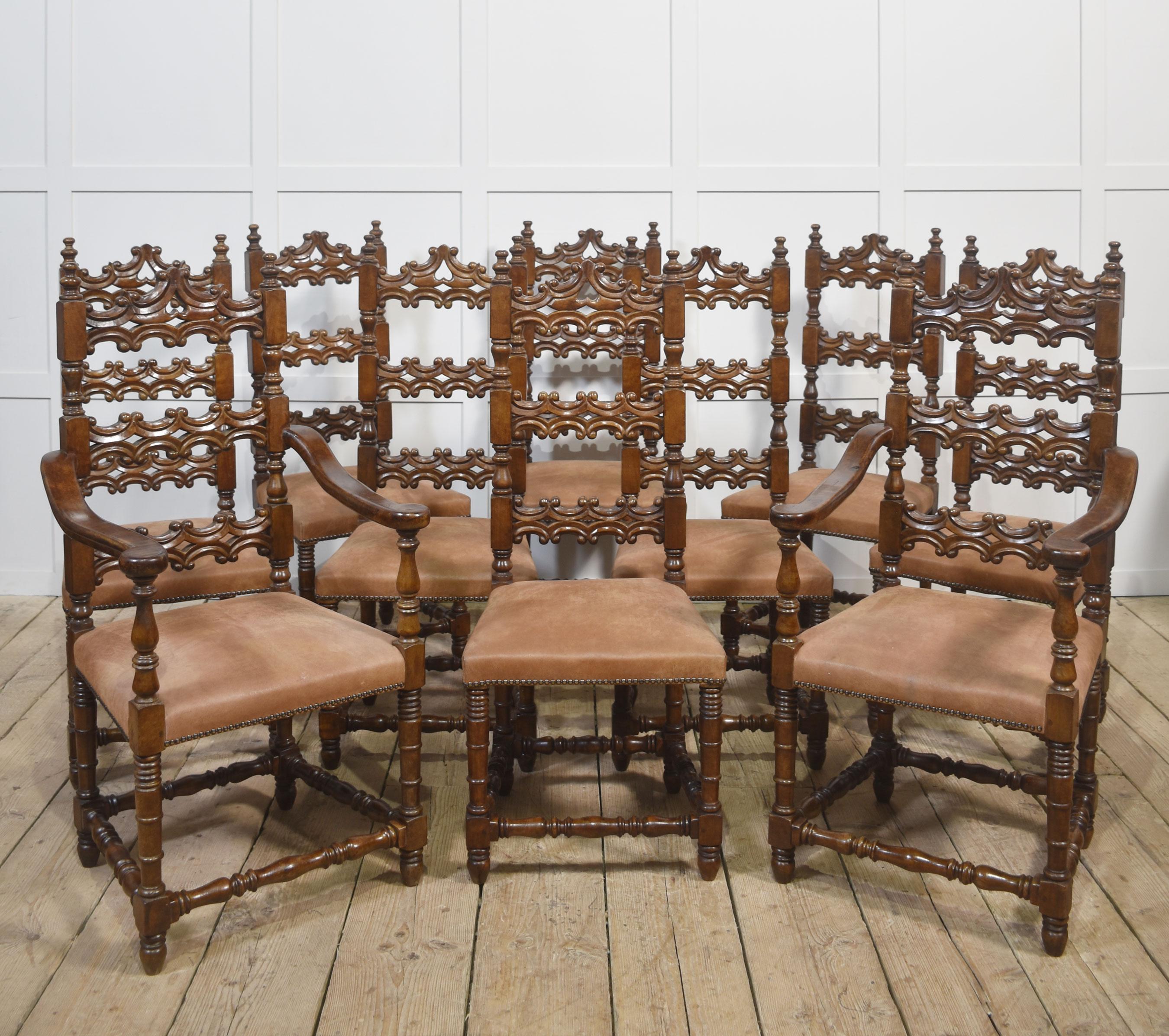 An exceptional set of ten antique dining chairs, including two armchairs and eight side chairs, beautifully crafted from solid walnut in the 17th-century Louis XIII style. Each chair features an intricately carved high back with pierced scrollwork