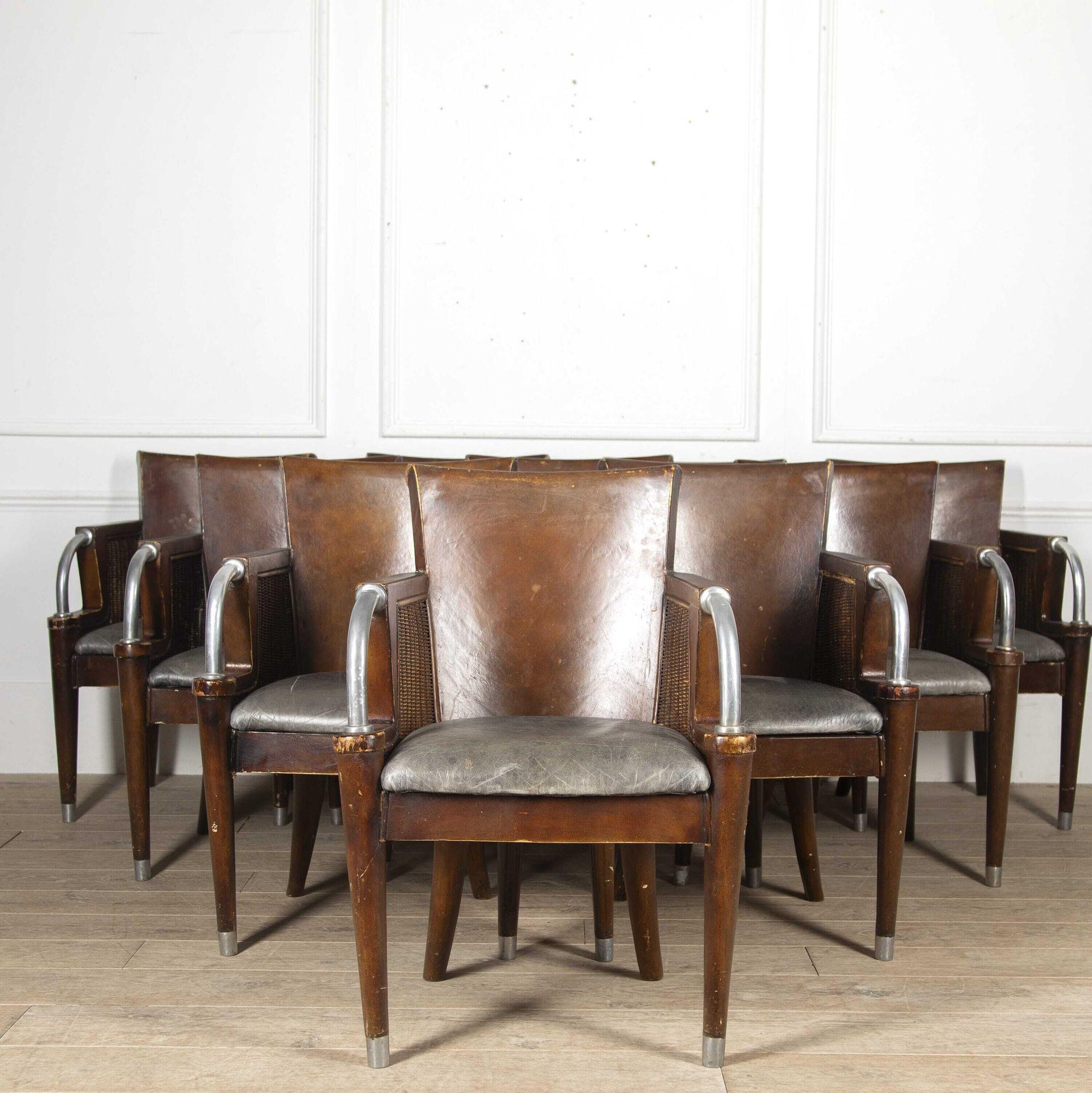 Set of ten armchairs in the Art Deco style.
These charming chairs are constructed from a mixture of wicker, metal, and leather and are of very good size. All ten chairs have sturdy constructions with very few signs of wear. 
They are believed to