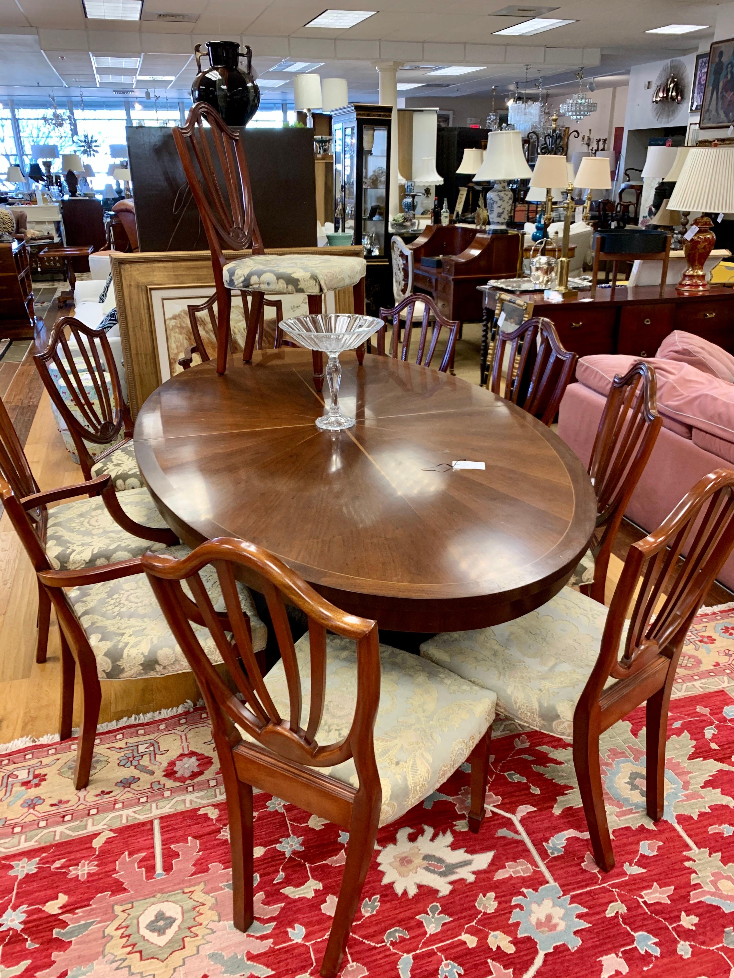 Stunning set of ten Baker Furniture Chippendale dining chairs. There are eight side chairs and two armchairs.