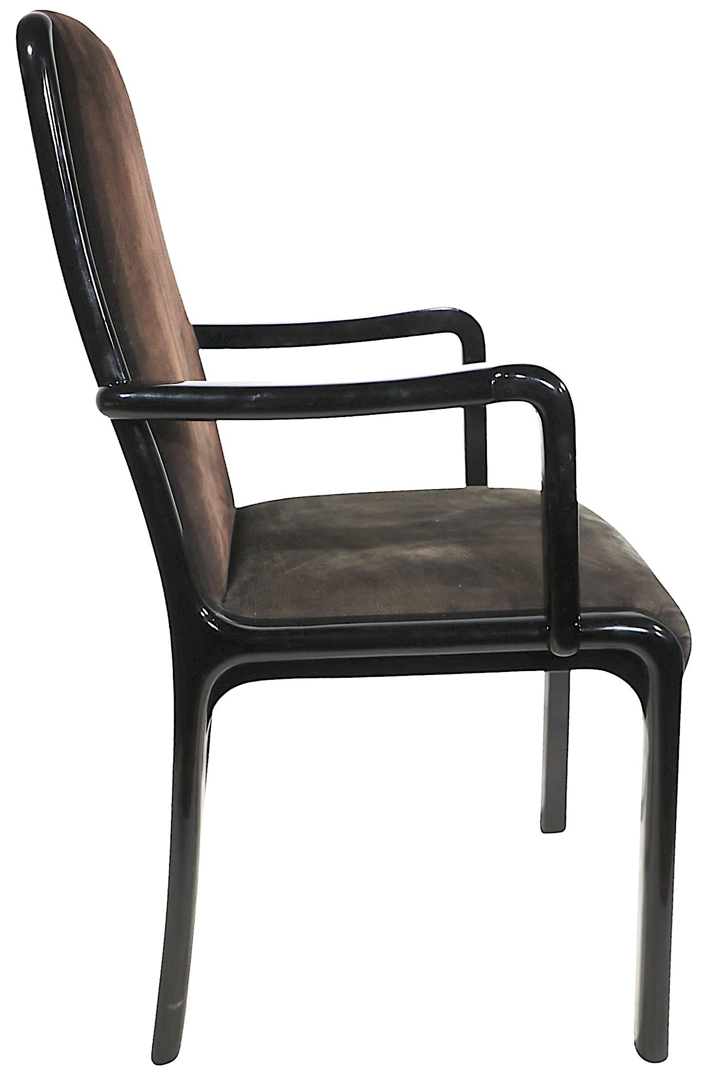 High style set of Art Deco Revival, Hollywood Regency, Postmodern black lacquer dining chairs, designed by Paolo Barracchia made in Italy by Roman Deco, circa 1980's. The chairs feature stylish, elegant and sophisticated black lacquer frames with