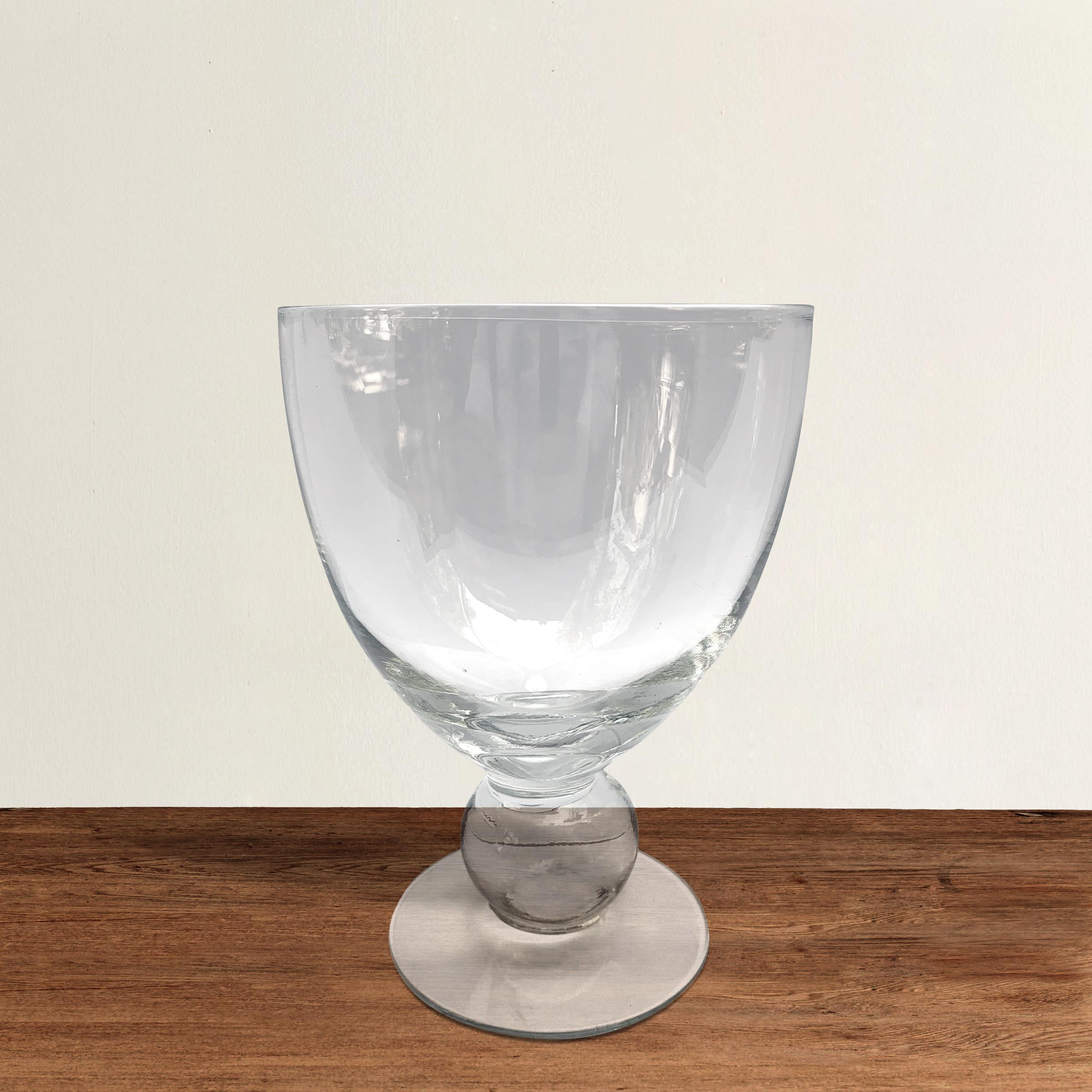 A set of ten American hand blown wine goblets with a beautiful large spherical knob stem and a wide foot.
