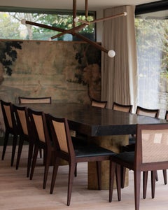 Set of Ten Cane‑Back Dining Chairs with Dark Green Leather Seats