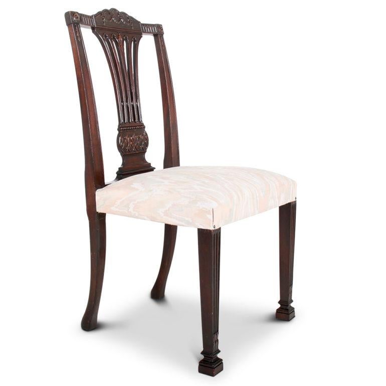 A set of ten elegant, hand-carved mahogany Sheraton-Revival dining chairs manufactured by the Cowan Furniture Co. in Chicago USA. (Stamped ‘Cowan Chicago’.) Circa 1910.

These are sturdy and comfortable chairs with beautiful details and a warm
