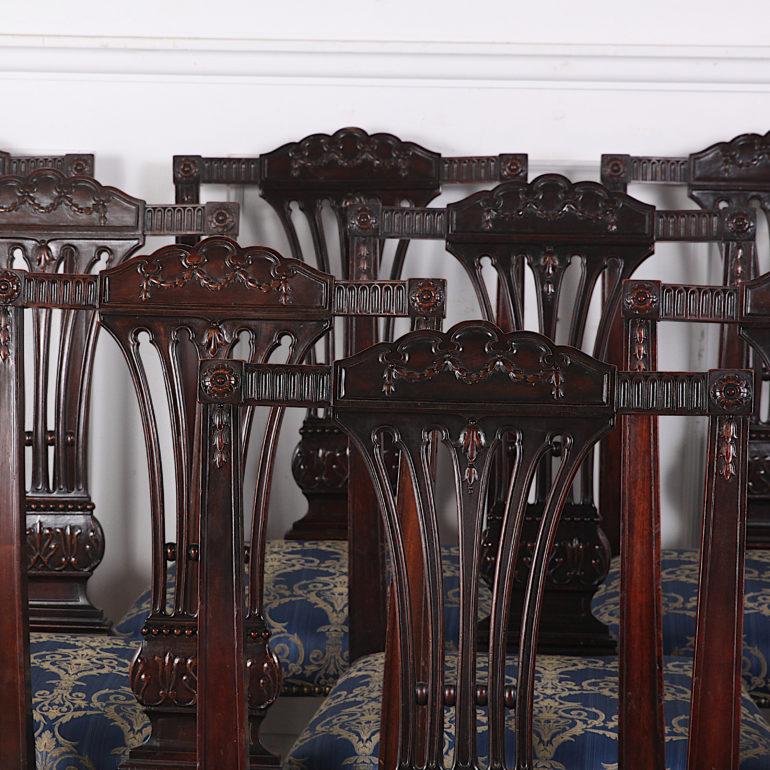 A superb quality set of ten hand carved Sheraton-revival mahogany dining chairs manufactured by the Cowan furniture company in Chicago. This model was part of their 'Adams' line referring to the English 18th century classical architect and designer