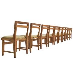 Set of Ten Carved Oak Dining Chairs by Guillerme and Chambron