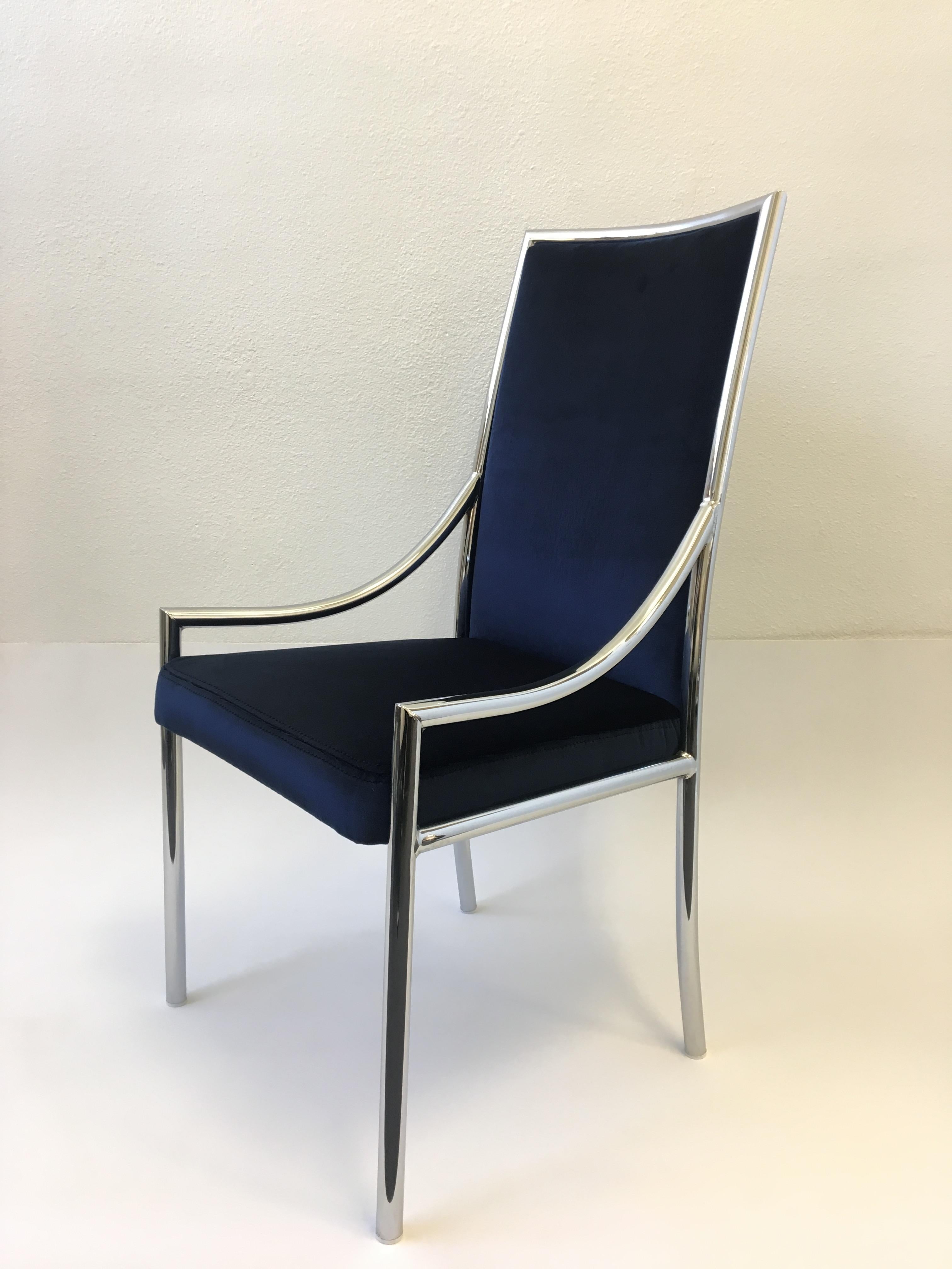 An amazing 1970s set of ten polished chrome dining arm chairs attributed to Pierre Cardin. The frames are in original condition. Newly recovered in soft royal blue velvet.

Dimension: 39.5