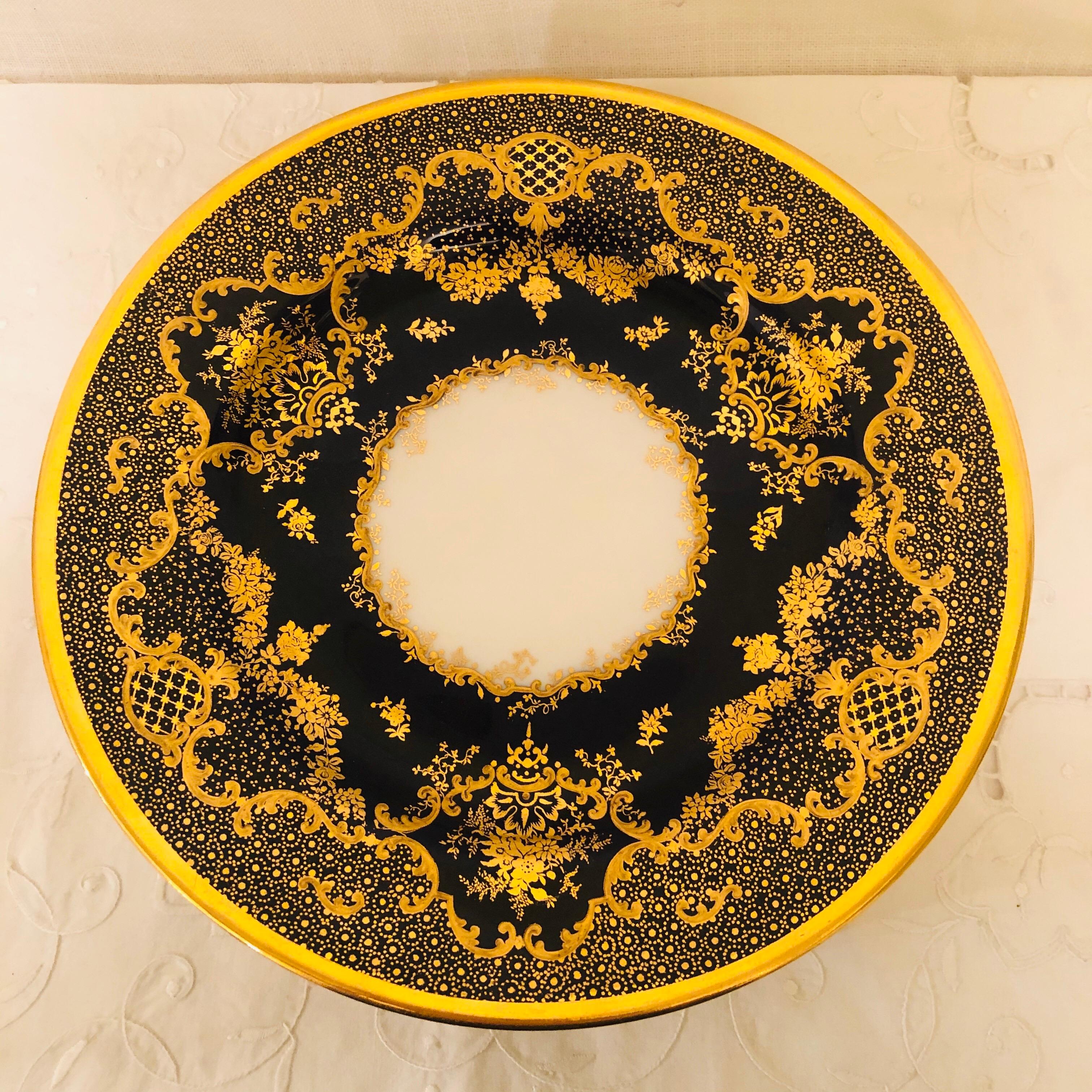 Set of ten cobalt Copeland dessert or luncheon plates with raised gilding on a fluted ribbon border. You can tell that the intricate detailed gilding on these plates has been done by an expert gilder. These plates are special enough to impress all