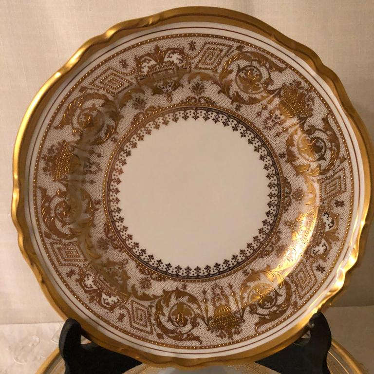 These are a set of ten Copelands China dessert or luncheon plates with profuse raised gilding. You can see the great talent of the gilder who elaborately gilded these plates. The porcelain companies like Copeland used to hire artists who spent their