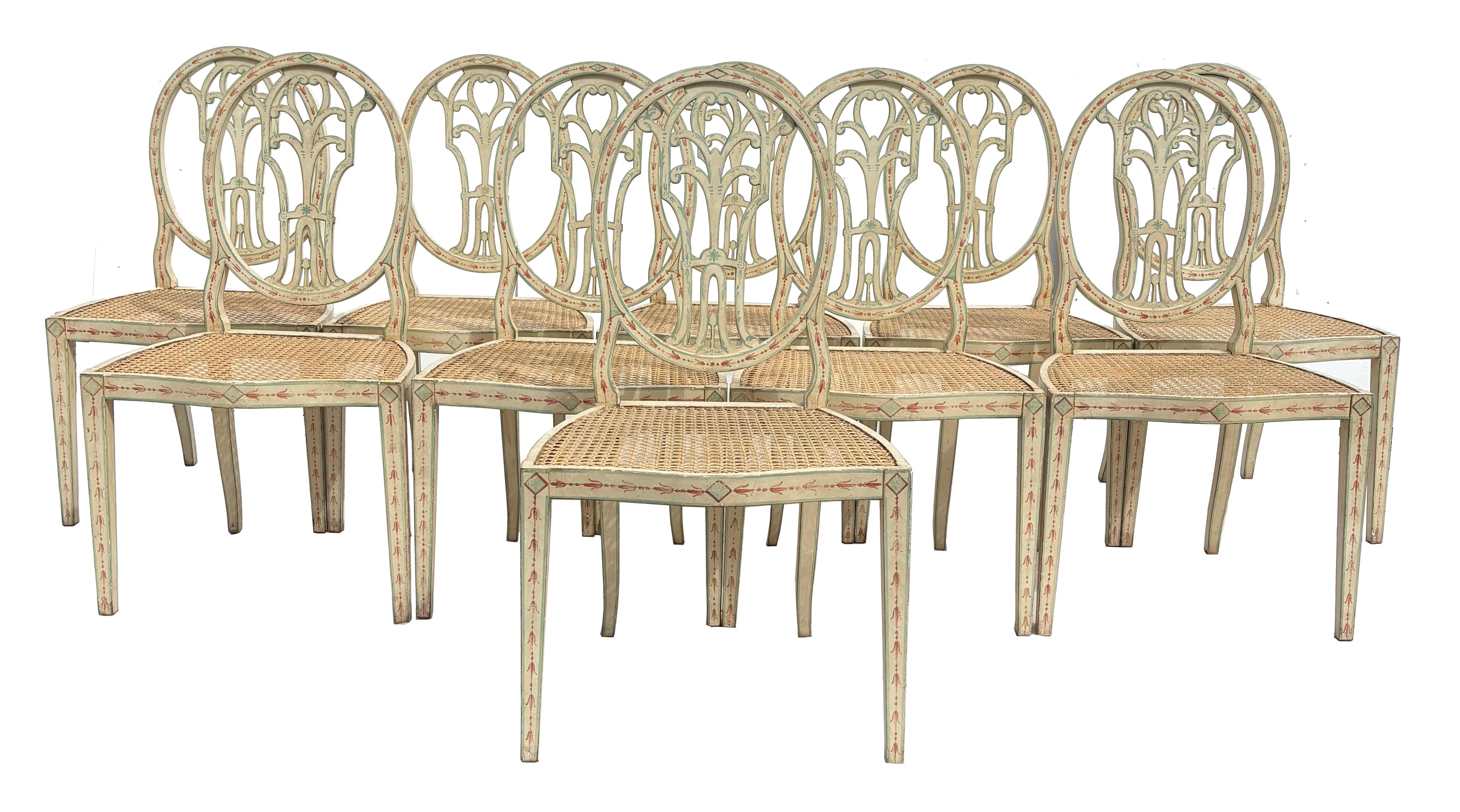  A long set of ten elegant chairs in the Regency/Hepplewhite manner.  The decoration in russet and aqua on a creamy ground color is typical of the period, and quite au currant today. 

We recommend a tailored and buttoned box seat thin enough to
