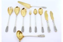 Set of ten cutlery items in gold-plated silver with reliefs on the handles