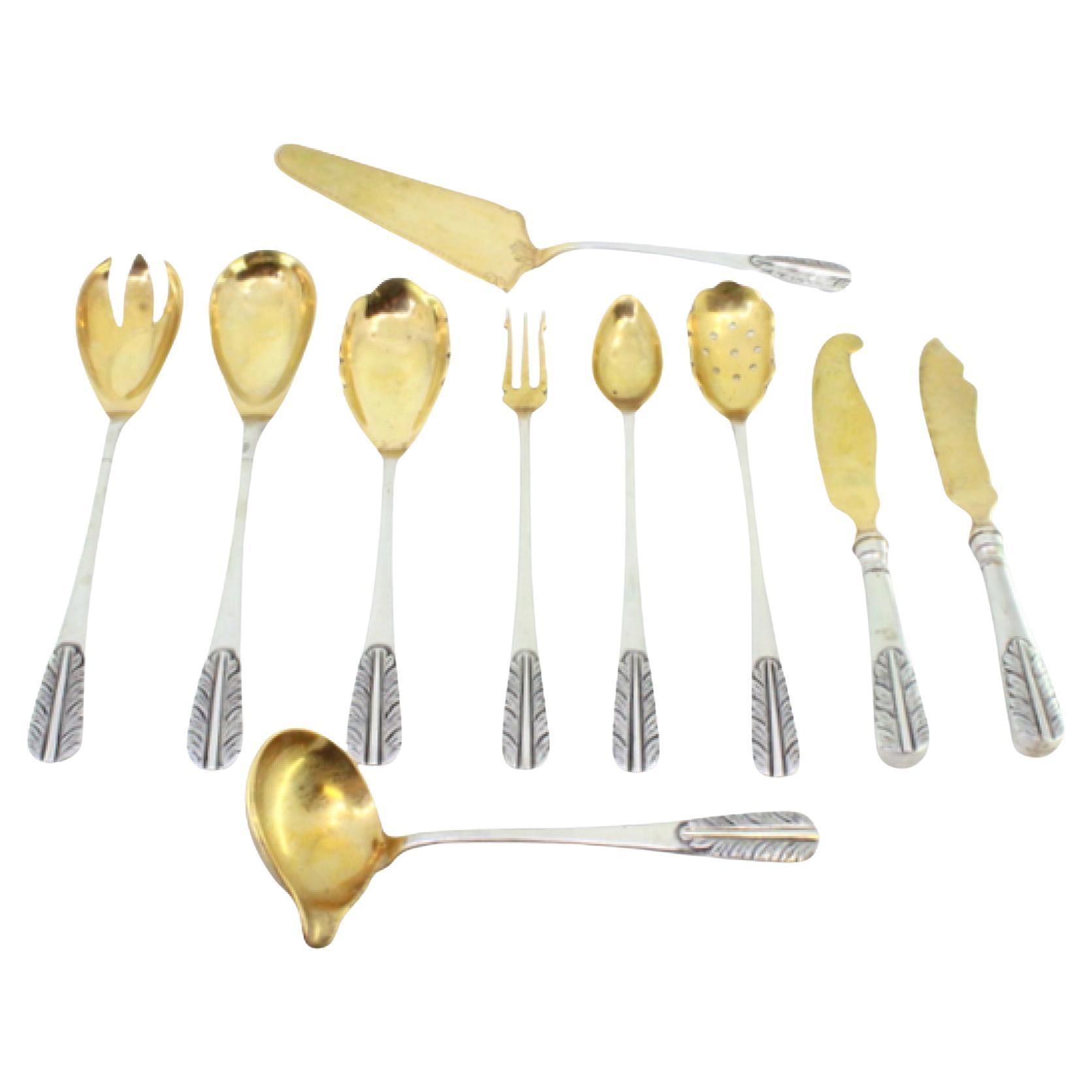Set of ten cutlery items in gold-plated silver with reliefs on the handles in vendita