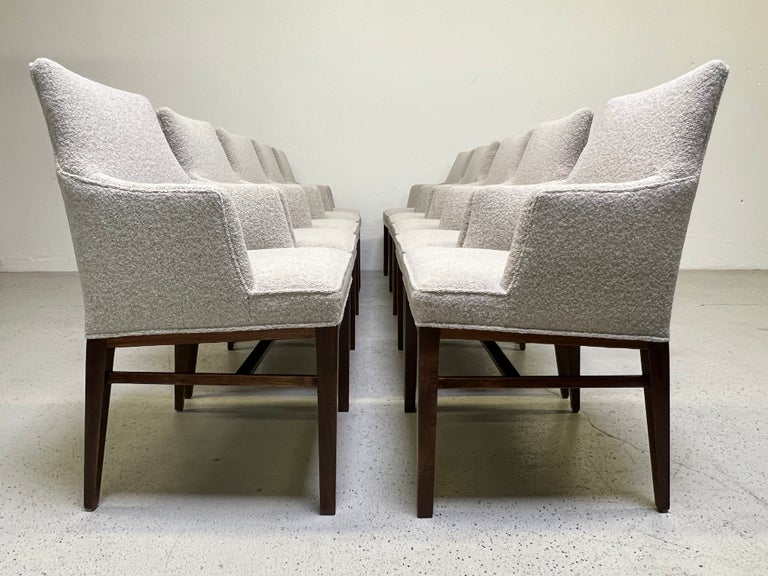 A rare set of ten armchairs designed by Edward Wormley for Dunbar. Fully restored with refinished walnut bases and upholstered in Designtex / Lambert fabric.