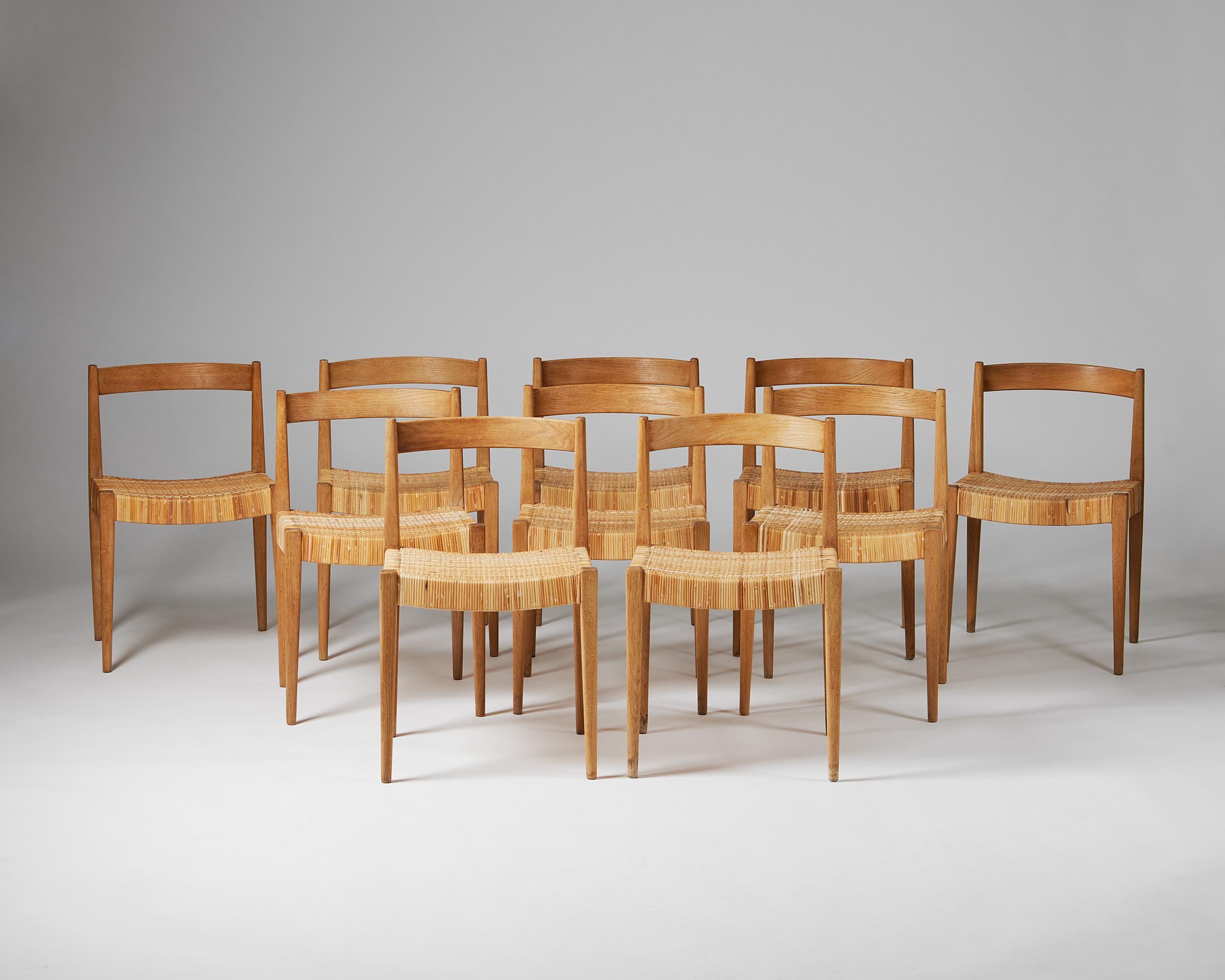 Set of ten dining chairs designed by Nanna and Jorgen Ditzel for Poul Kolds Sawmill,
Denmark. 1955.
Oak and rattan.

Measures: H: 70 cm / 2' 3 3/4