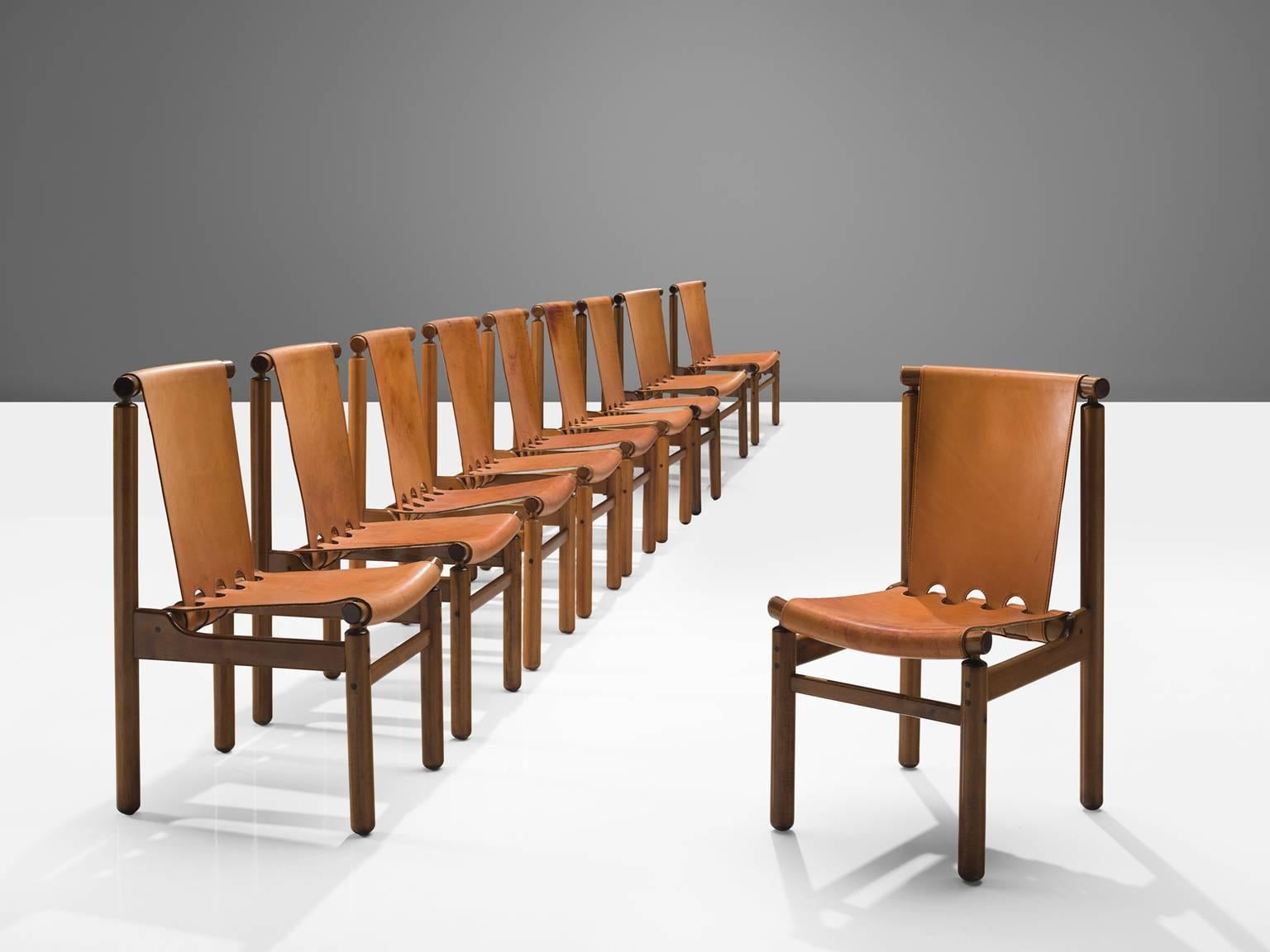 La Permanente Mobili Cantù, dining chairs, wood and leather, Italy, 1950s.

These robust chairs feature a geometric, sturdy frame. Yet they feature a certain spaciousness thanks to the decorative opening on the bottom of the backrest. The joints