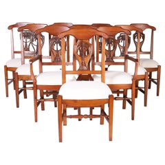 Set of Ten Dining Chairs with Carved Palm Trees