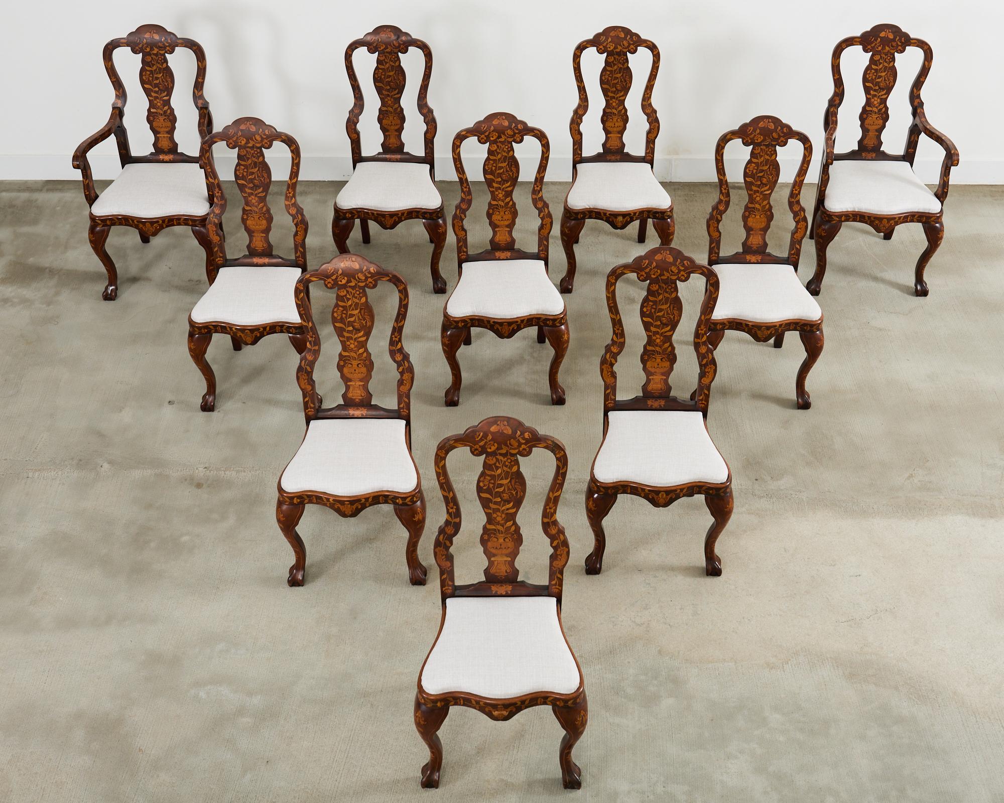 Magnificent set of ten 19th-century Dutch baroque dining chairs finely crafted from walnut. The chairs feature large frames embellished with decorative marquetry veneer inlay depicting neoclassical style urns on the splats and floral vine patterns