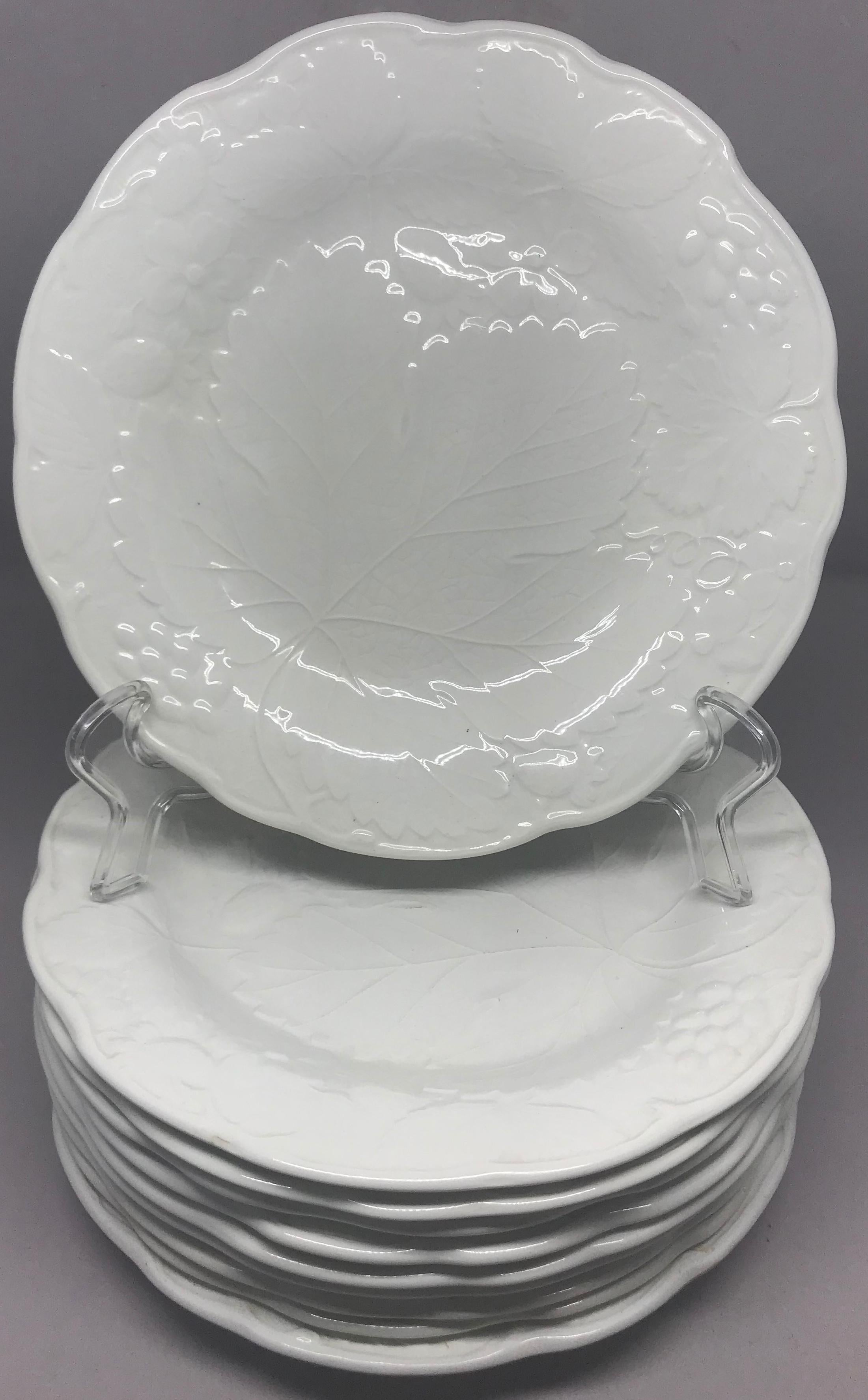 Set of ten each white strawberry leaf dinner and lunch/dessert plates. Davenport Burleigh dinner and luncheon plates in the strawberry and grape leaf pattern, England, 20th century.
Dinner plate dimensions: 9.88
