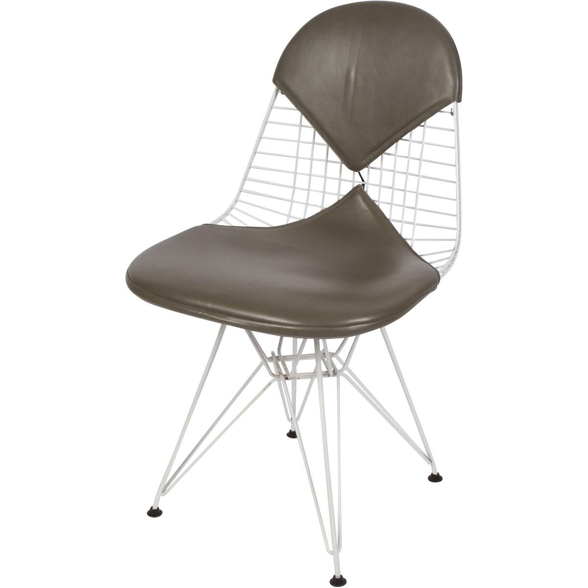 Vintage Eames DKR chairs with gray leather bikini pads produced for Herman Mimller, 1980s.
