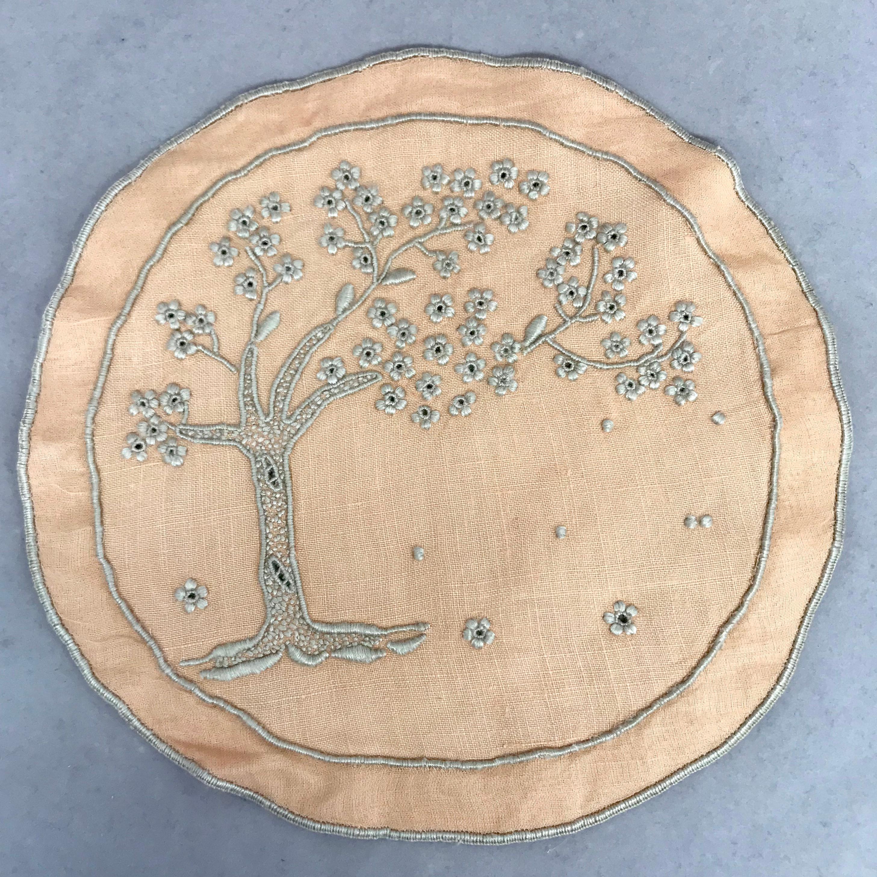 Set of ten embroidered tree of life coasters. Ten peach and oyster color embroidered large round coasters / doilies with large flowering tree, England, 1930s
Dimensions: 5.5