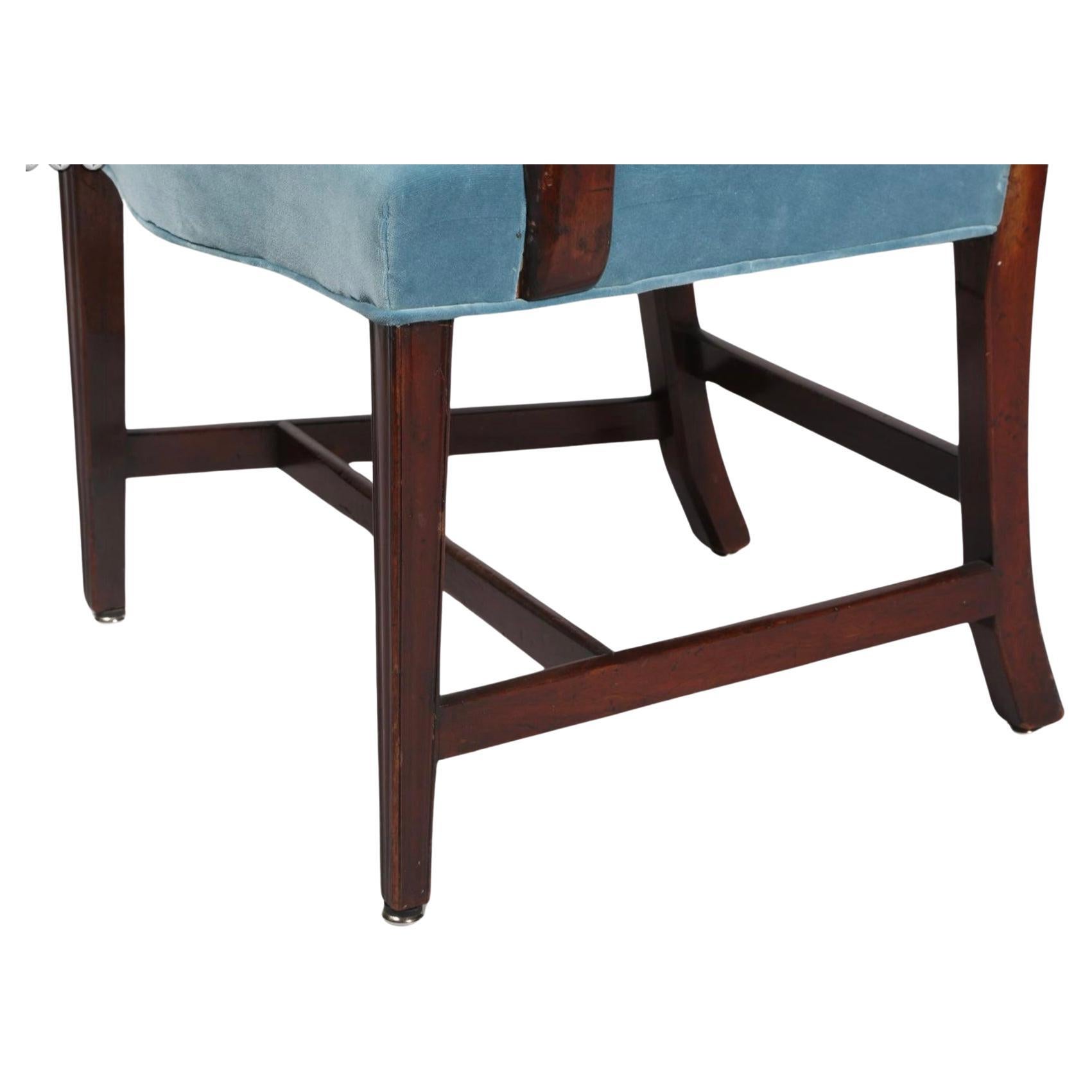 Set of Ten English Chippendale carved mahogany dining chairs with upholstered seats. Seats are upholstered in light blue. Chairs have carved and open splats, curved arms and H-stretchers as support. Set consists of 9 side chairs and one arm chair.