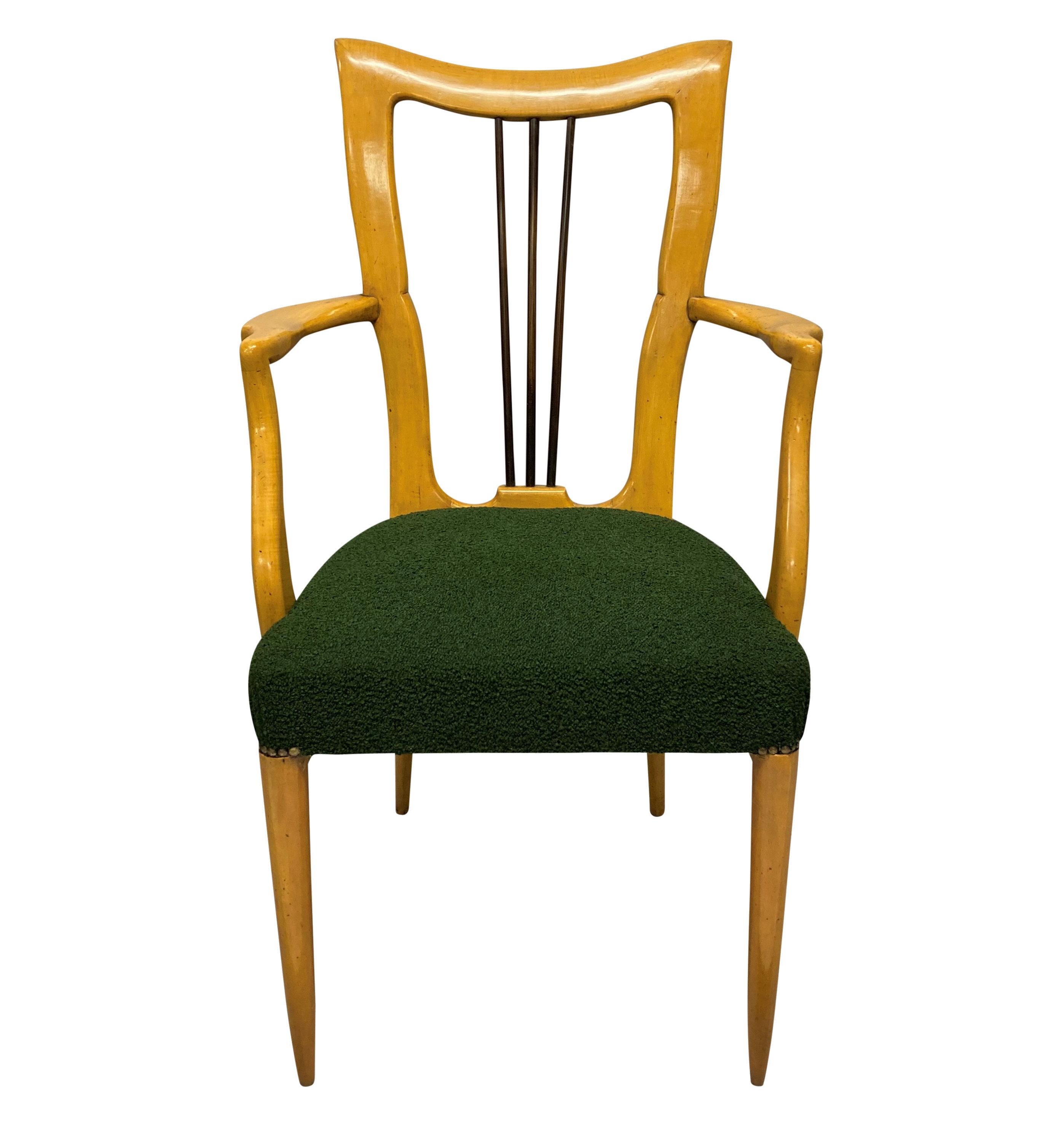 A set of ten Italian Mid-Century dining chairs by Paolo Buffa in birch wood. With beautifully sculpted lire shaped backs and newly upholstered in dark green wool boucle.

Measure: 100cm high (backs) x 49cm high (seats) x 46cm wide x 49cm deep &