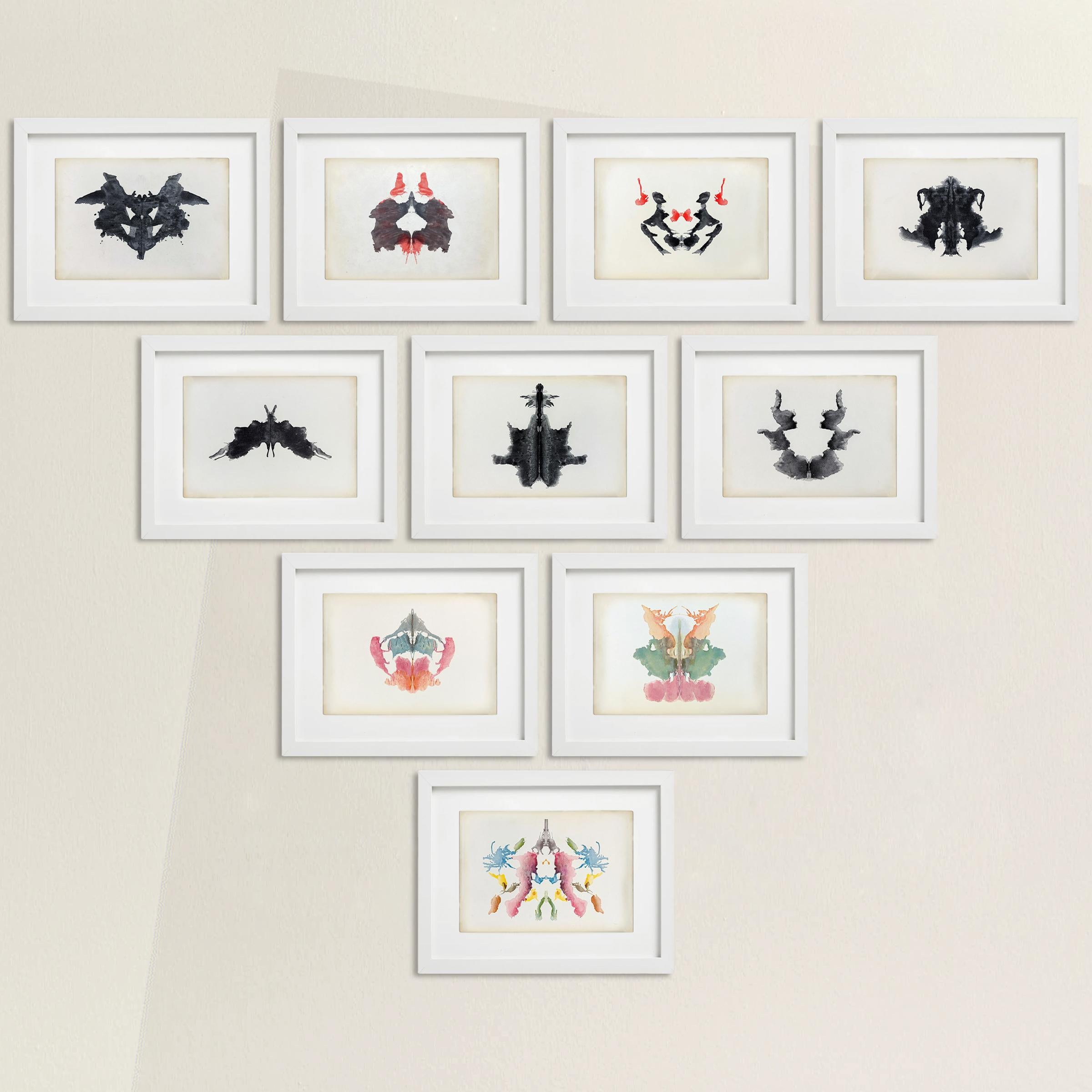 A remarkable set of ten mid-20th century original Rorschach inkblot cards in full black & white and color printing, and framed behind glass in white gallery frames.