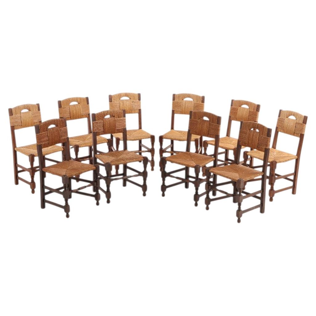 Set aus zehn französischen Esszimmerstühlen im Stil von Charles Dudouyt, um 1940