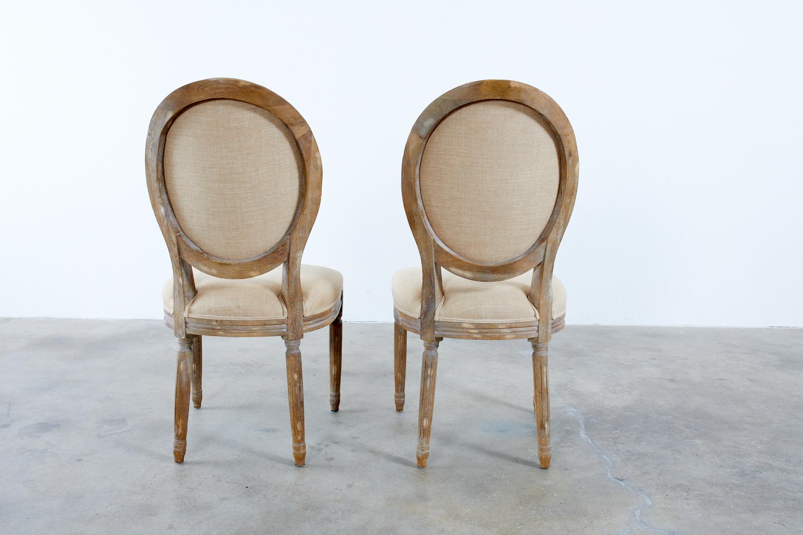 Set of Ten French Louis XVI Style Oak Dining Chairs 12