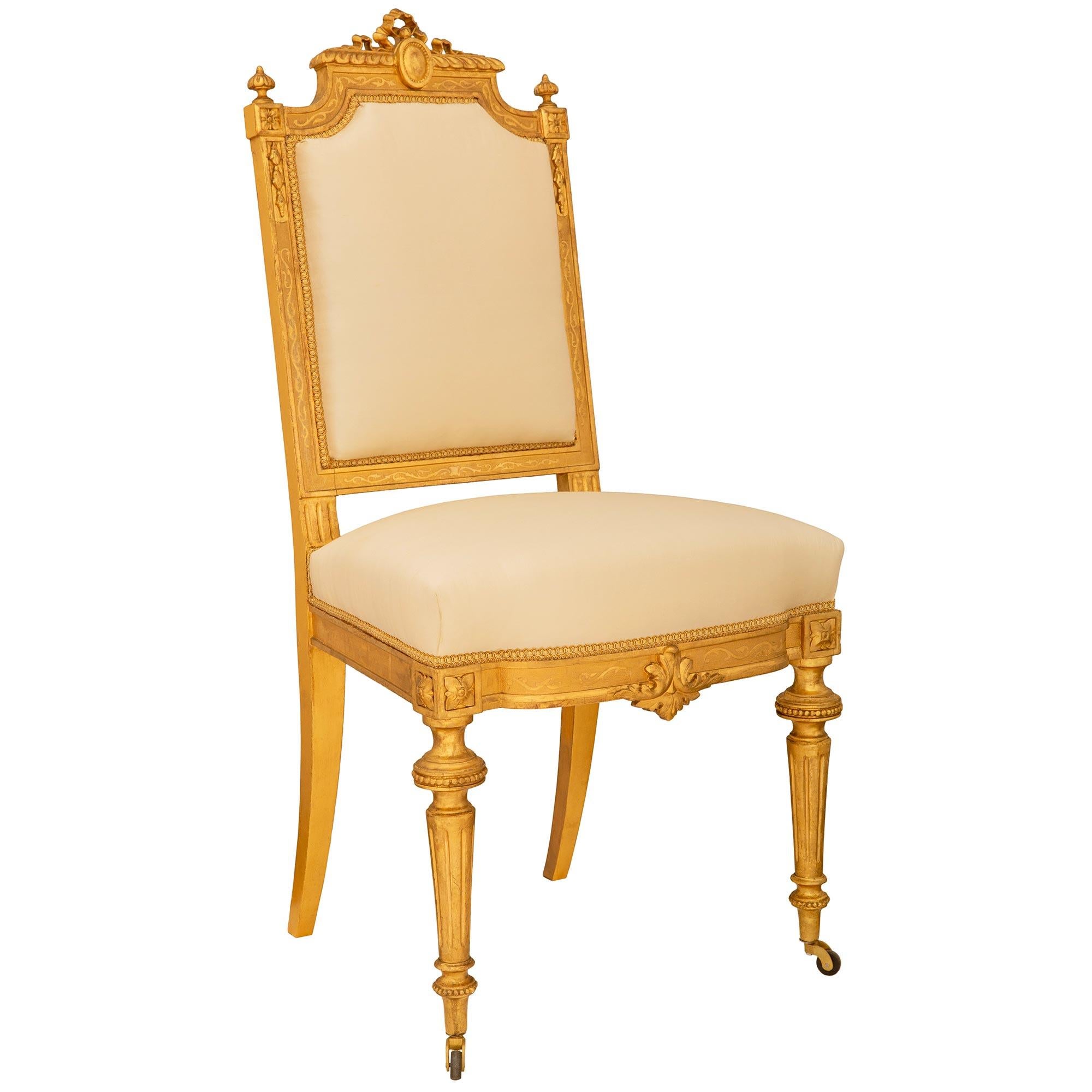 19th Century set of ten French mid 19th century Louis XVI st. Giltwood dining chairs