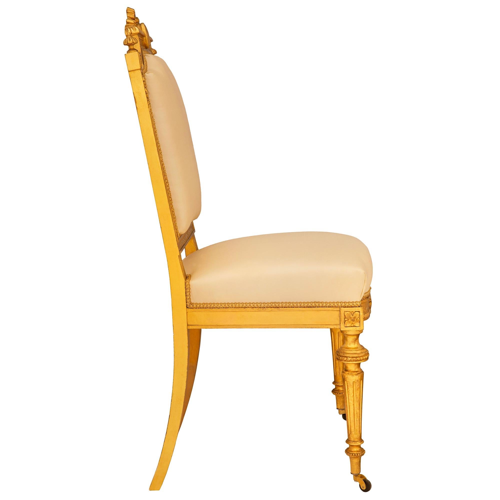 set of ten French mid 19th century Louis XVI st. Giltwood dining chairs 1