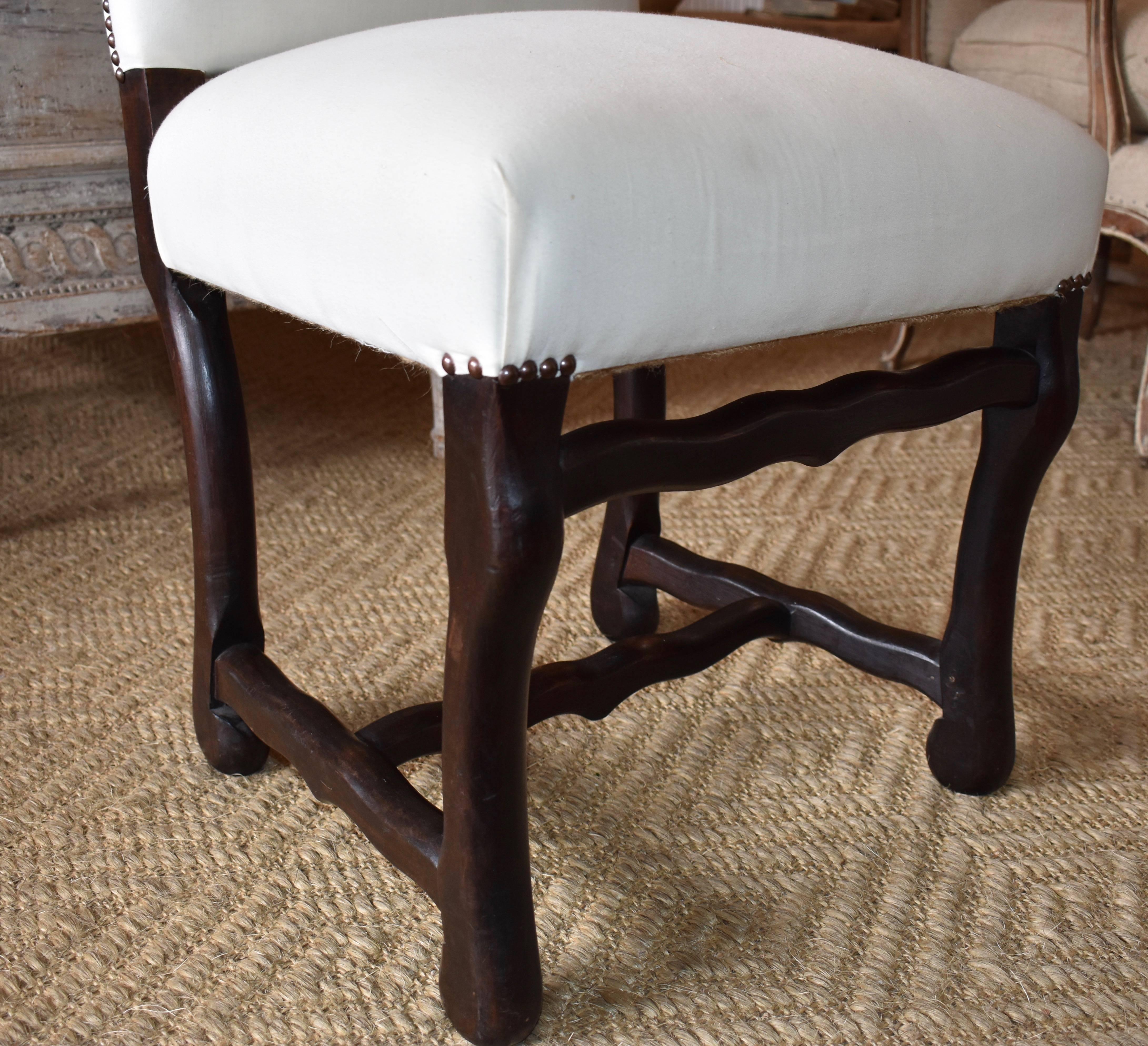 Very nice set of ten Os de Mouton dining chairs from Normandy, France. Sturdy and very comfortable.