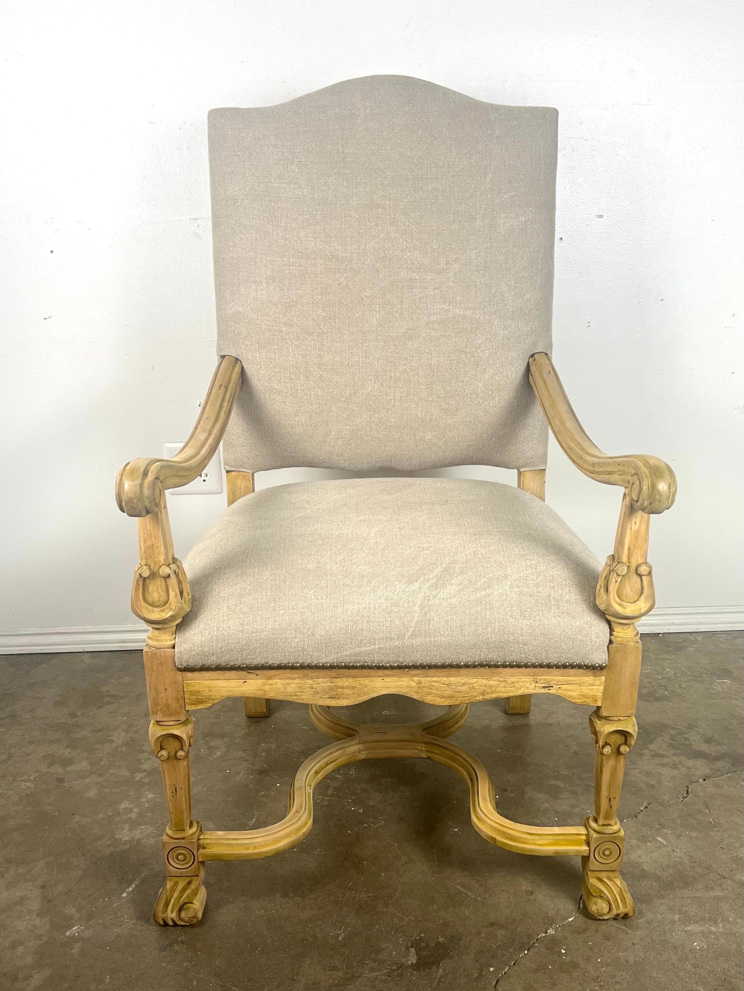 This set of 10 French Provincial dining chairs showcases a classic and refined design.  The eyebrow shaped tops of these chairs add a unique architectural element that brings soft curves and visual interest.  Upholstered in natural Belgian linen,