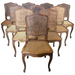 Set of Ten French Provincial Louis XV Style Walnut and Caned Dining Chairs