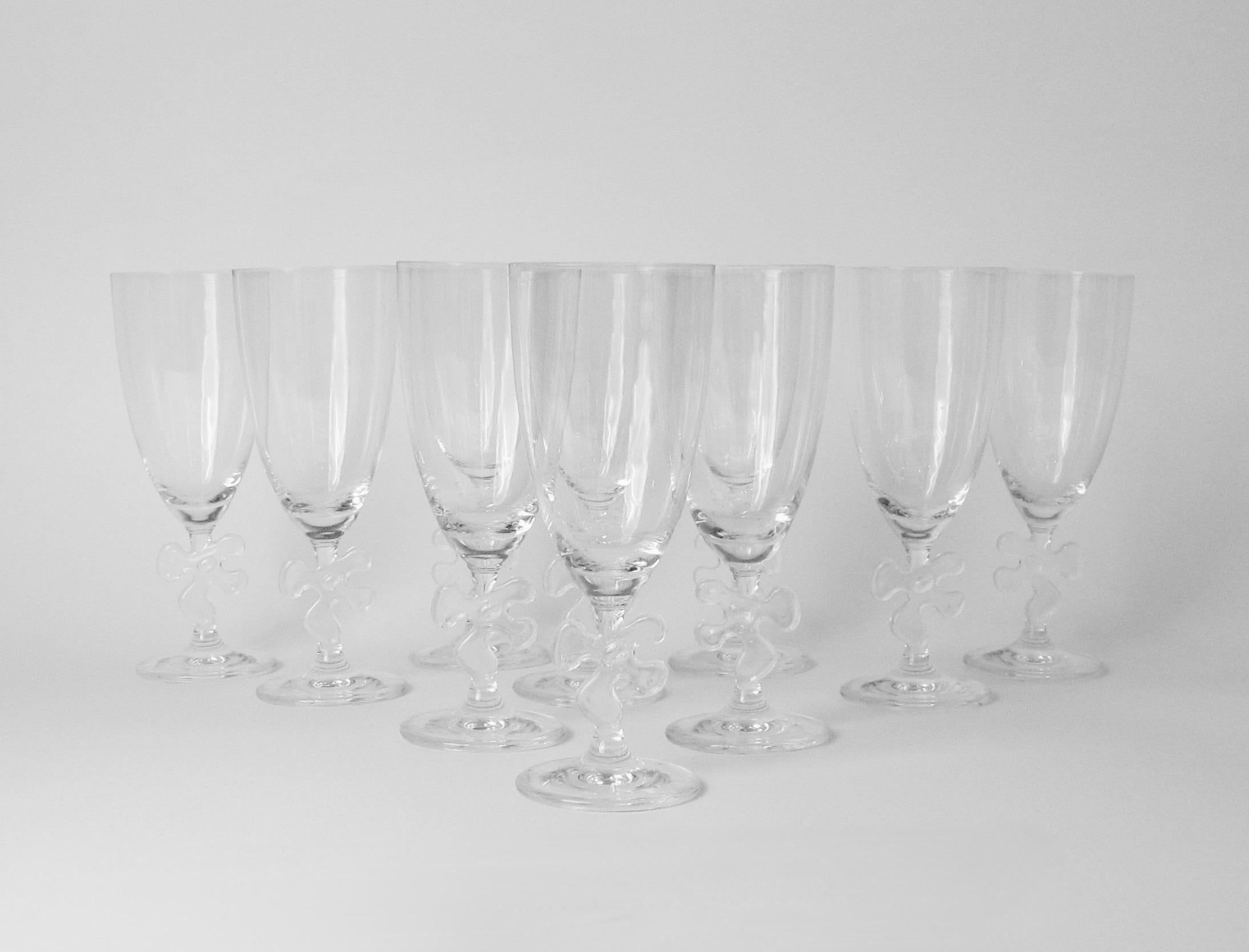 Large set of twelve Water glasses by Marc Auer. Whimsy and elegance crystal glass on jigsaw embellished stem. Acid stamped Marc Auerel.