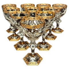 Set di dieci calici in cristallo dorato e argentato, alla maniera di Baccarat