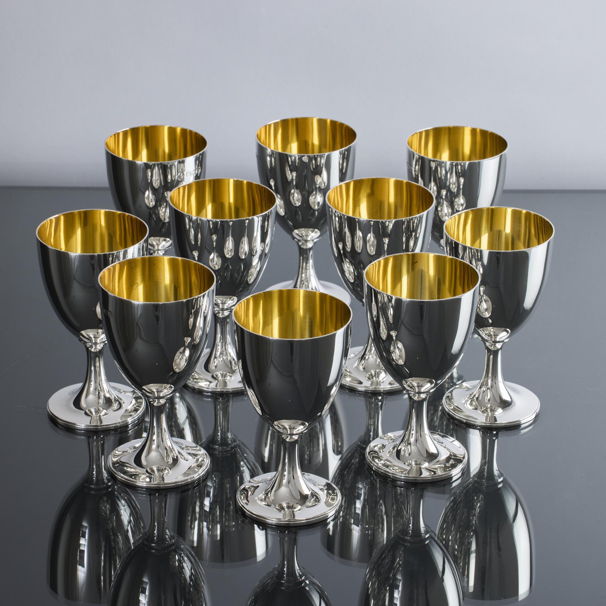 Set of ten gilt-lined silver wine goblets