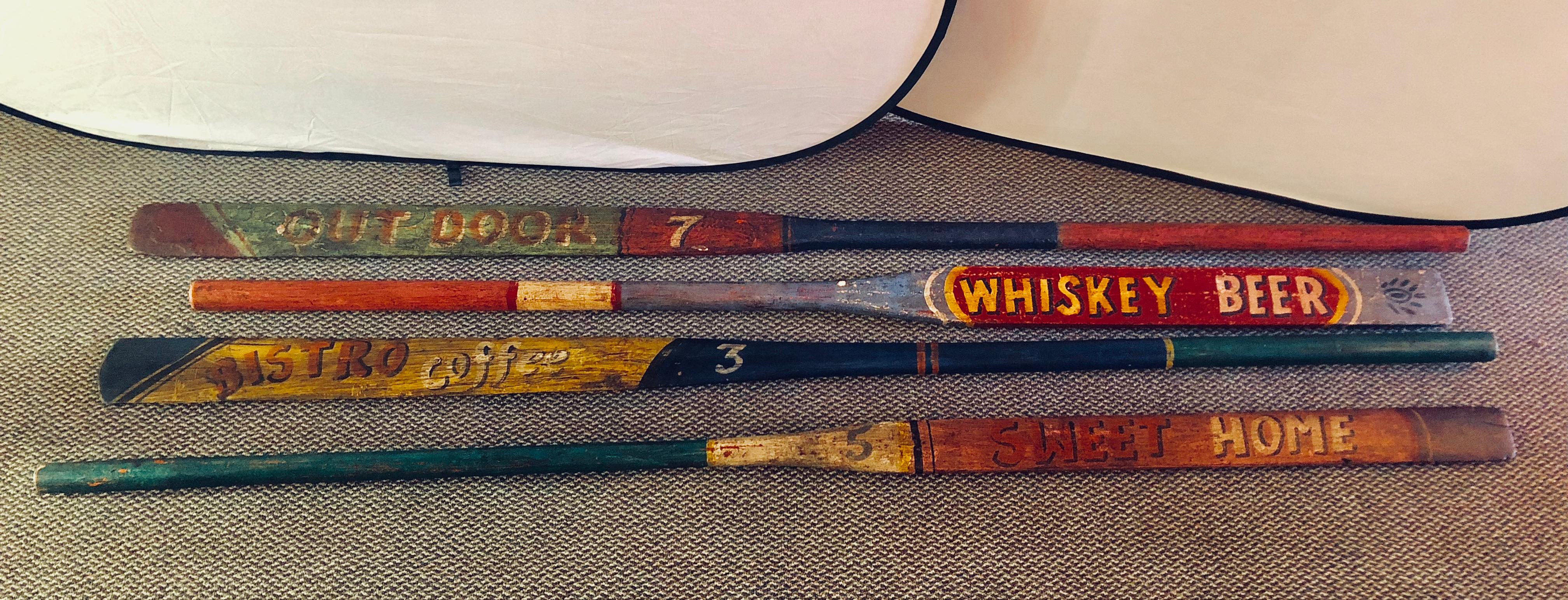 Set of 8 hand-painted inspirational rowing oars or paddles. Priced individually. Each in a rustic painted design having inspirational writings.
