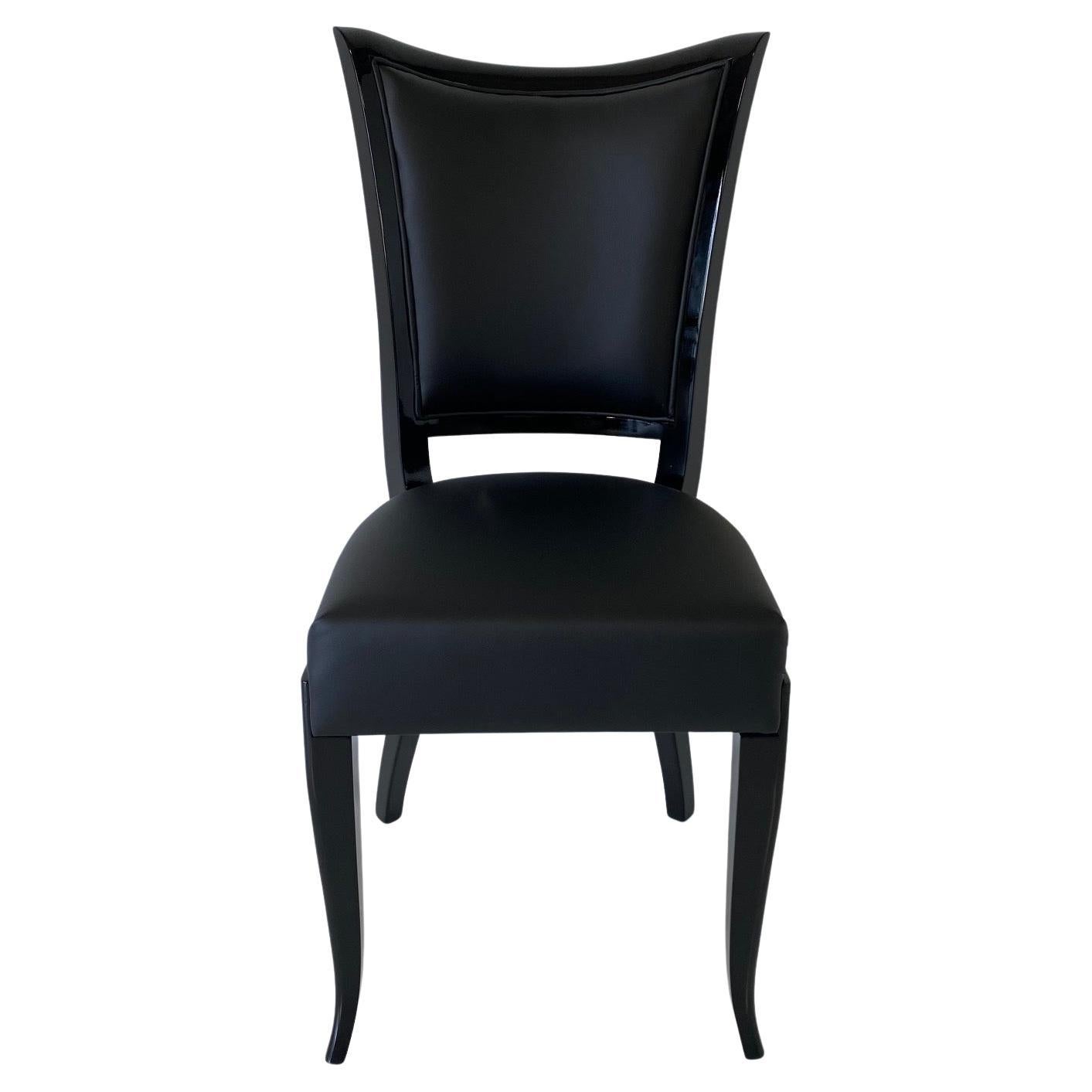 This set of eight Art Deco style chairs and two armchairs was produced in Italy in the 1980s. 
They are all completely black lacquered and covered in black faux leather. 

Measurements of the armchairs: 74 cm x 64 cm, total H 100 cm, seat H 50