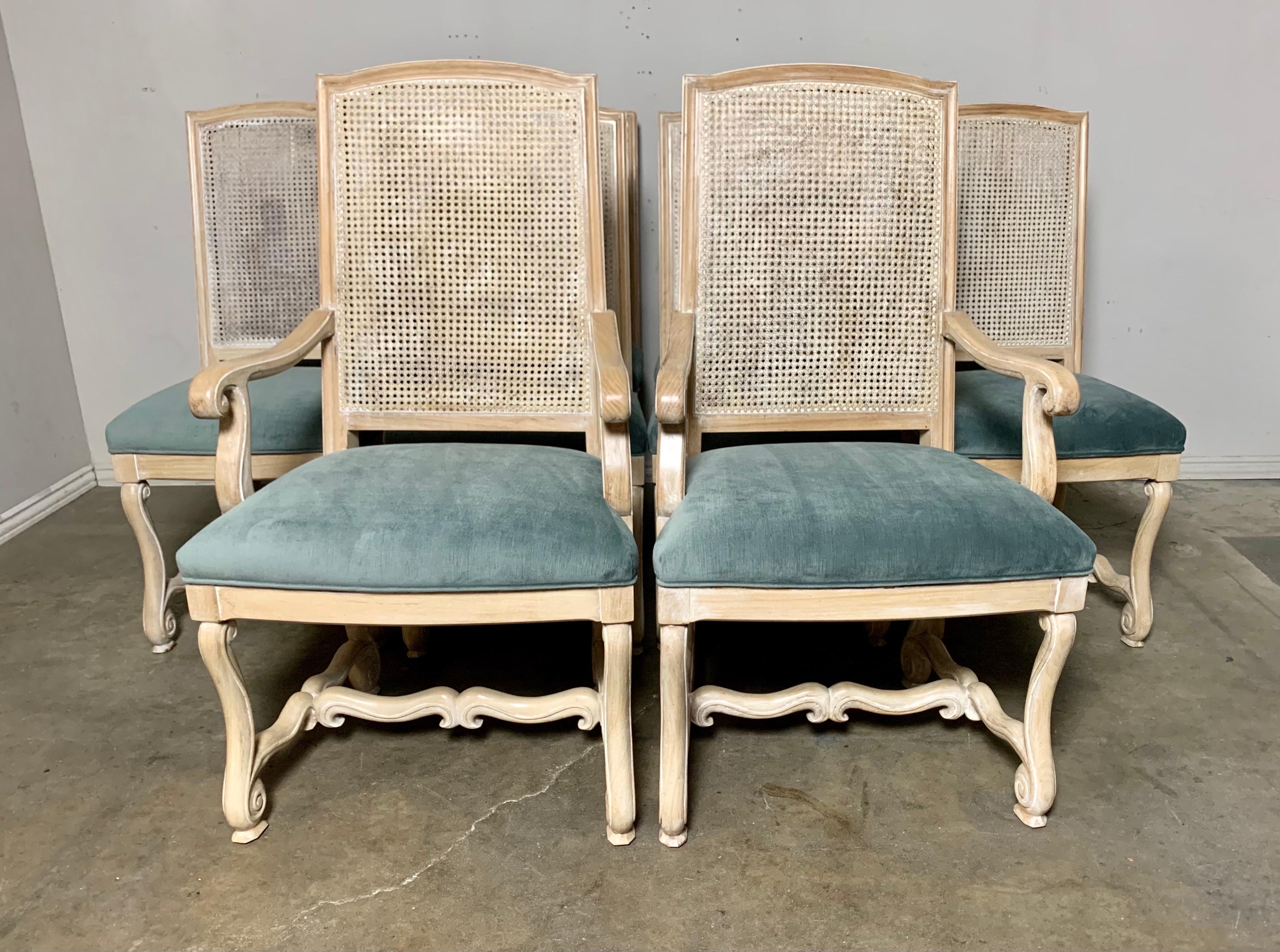 Set of ten vintage Italian velvet upholstered wood & cane dining chairs. The chairs have been newly reupholstered in a beautiful shade of blue velvet. The cane is in great condition.