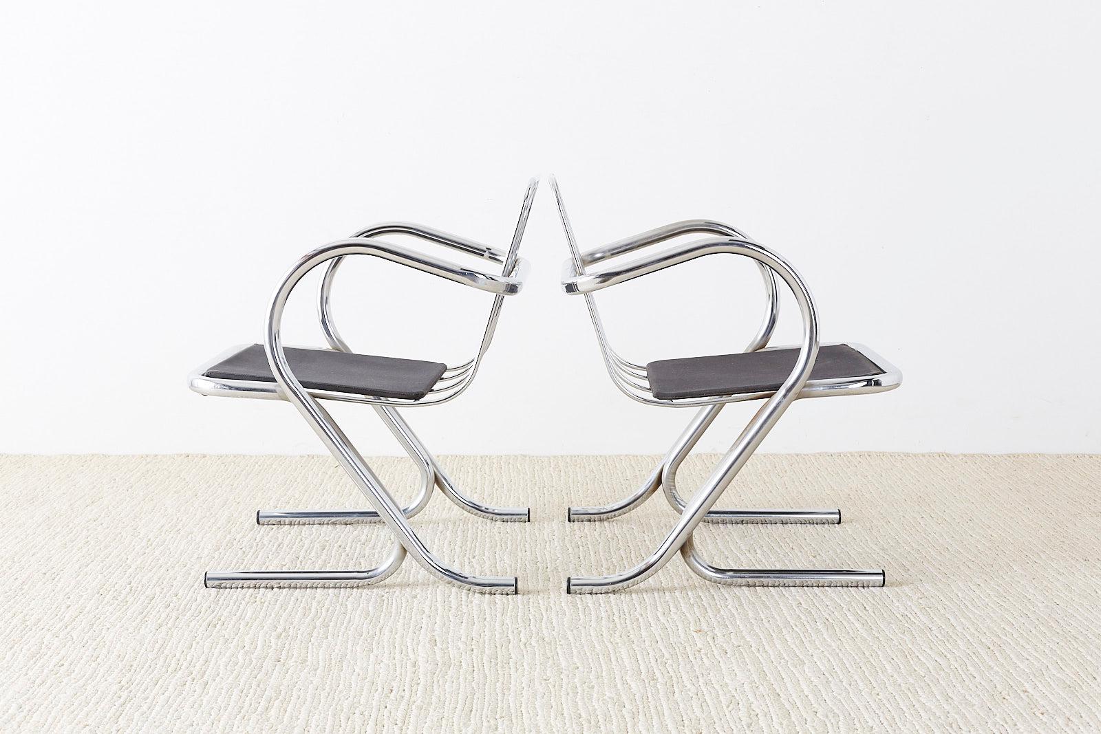 Rare set of ten Mid-Century Modern lounge chairs or armchairs designed by Jerry Johnson. Unique cantilever style constructed from chrome tube frames with canvas slings for support. Graceful curves on the arms which form legs that split into two