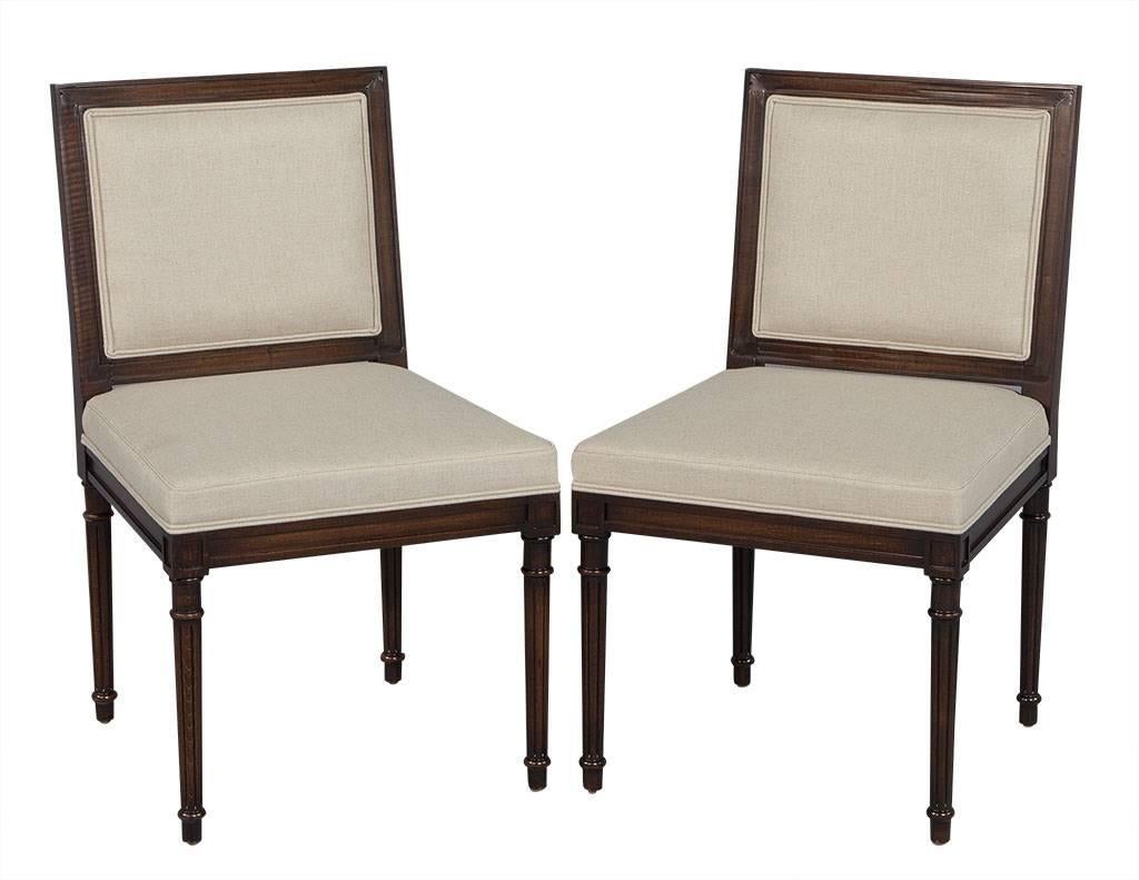 Set of ten Louis XVI style square back dining chairs. An elegant and unique set of Louis XVI dining chairs, custom finished and upholstered by Carrocel. This chair features a classic Louis XVI design with the square back, square seat and fluted