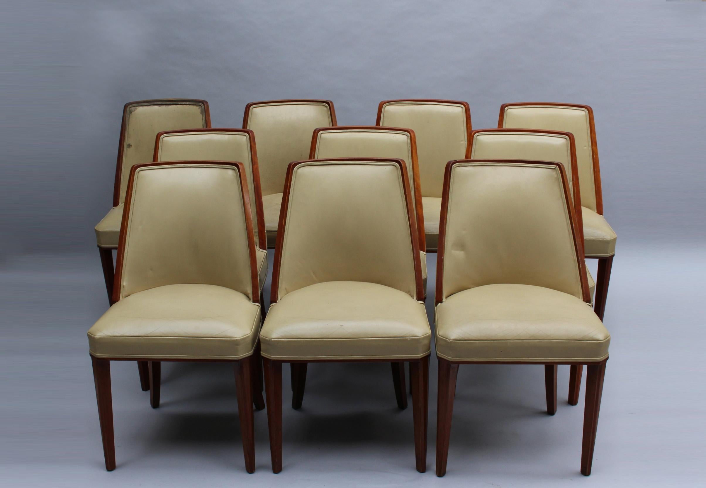 A set of ten fine French Art Deco mahogany dining chairs by Albert Guenot for 