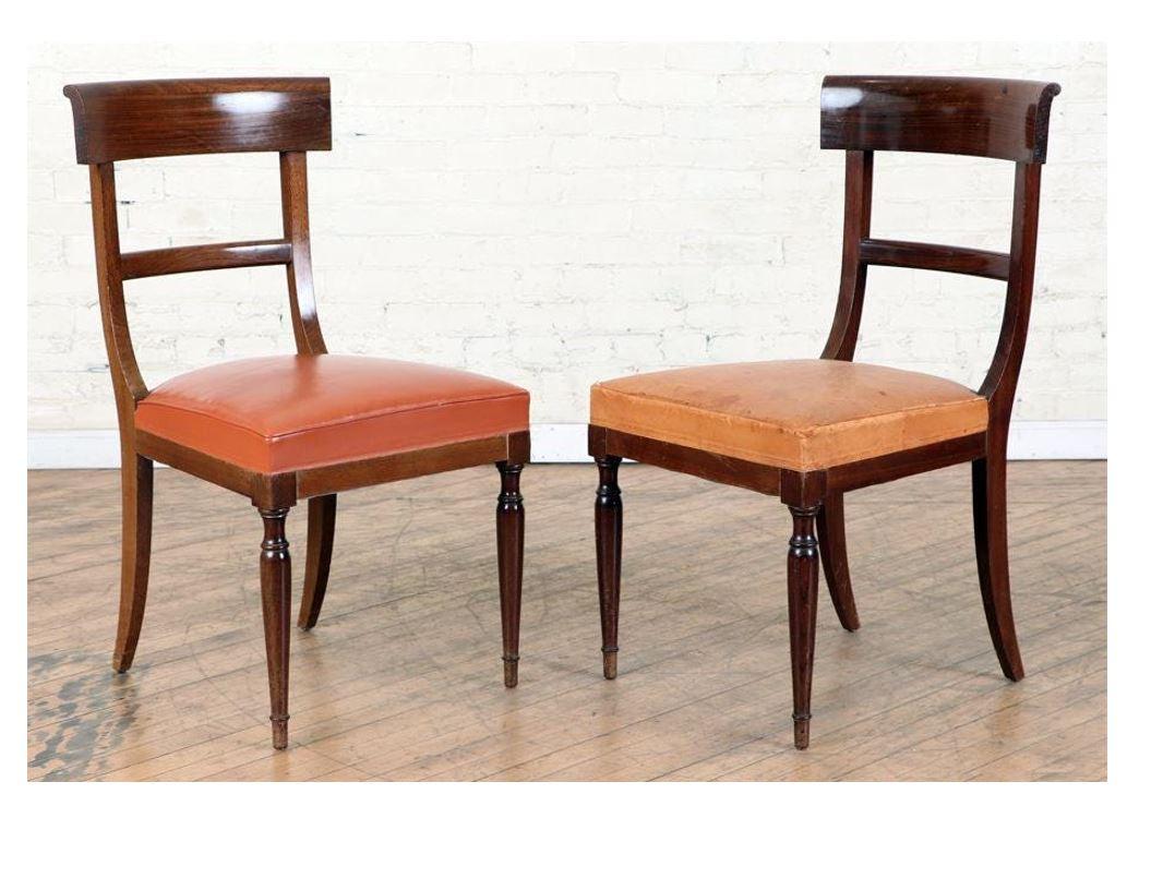 Set of ten Regency style mahogany dining chairs circa 1920 with single plank back rest, straight turned legs and orange leather seats.