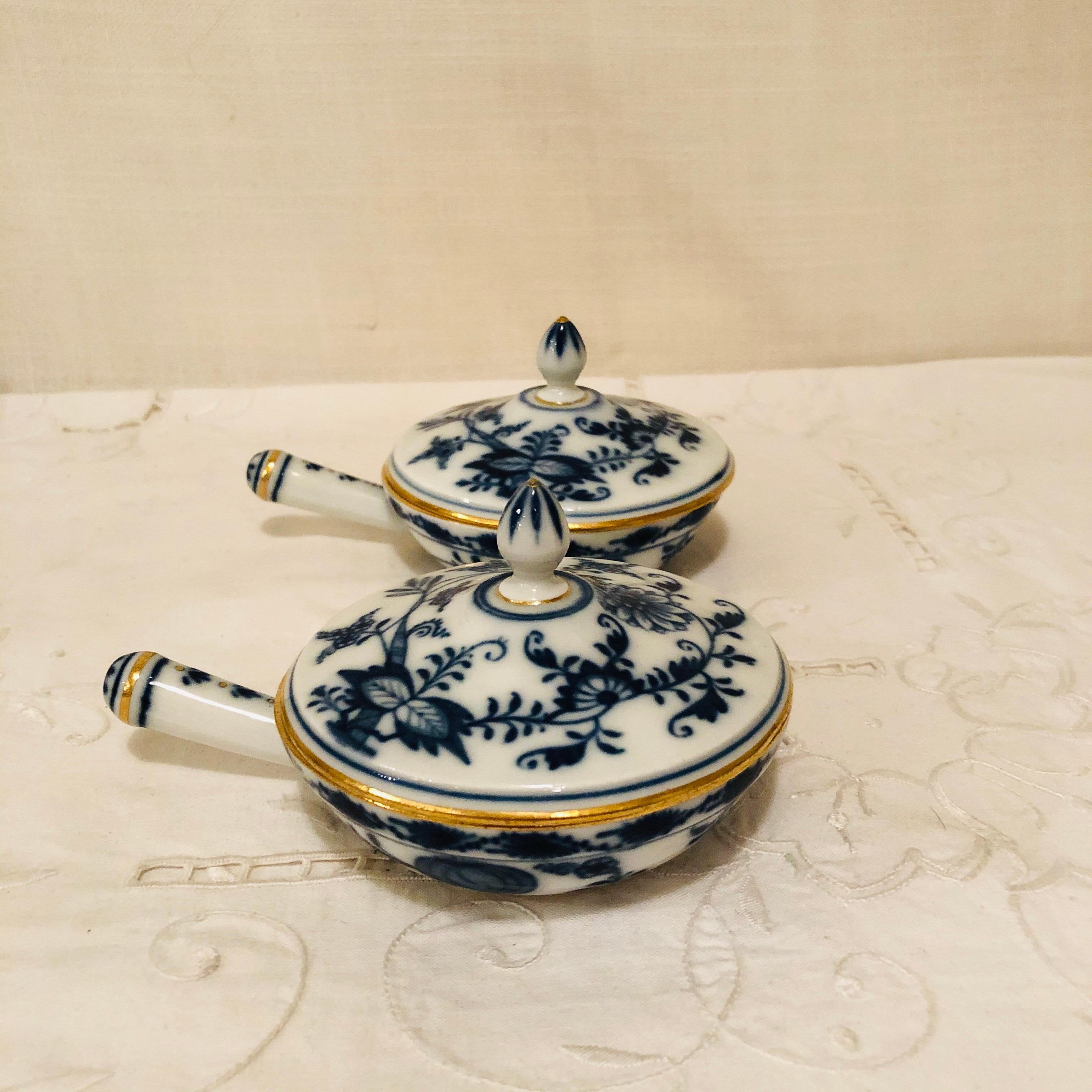 We are proud to offer you this set of ten very rare Meissen blue onion pots de crème complete with handles and covers and gold rims and accents. They were made before 1890, and they are first quality Meissen. Think about the delicious desserts you