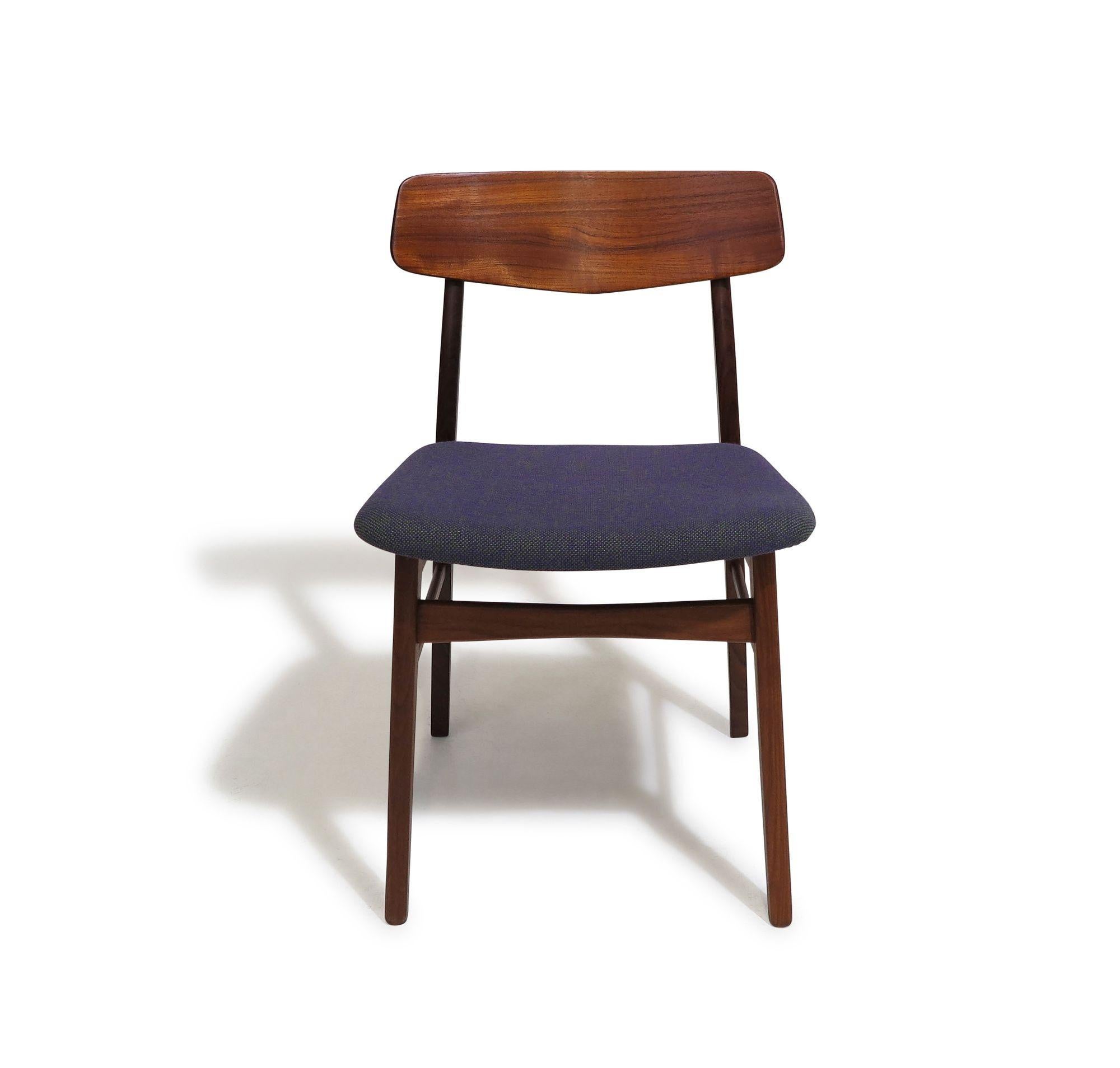 Restored set of ten mid-century Danish dining chairs handcrafted of old-growth teak with sculpted backrests and floating seats supported by brass risers. The seats have been newly upholstered in woven purple and green wool Hallingdal. The wood has
