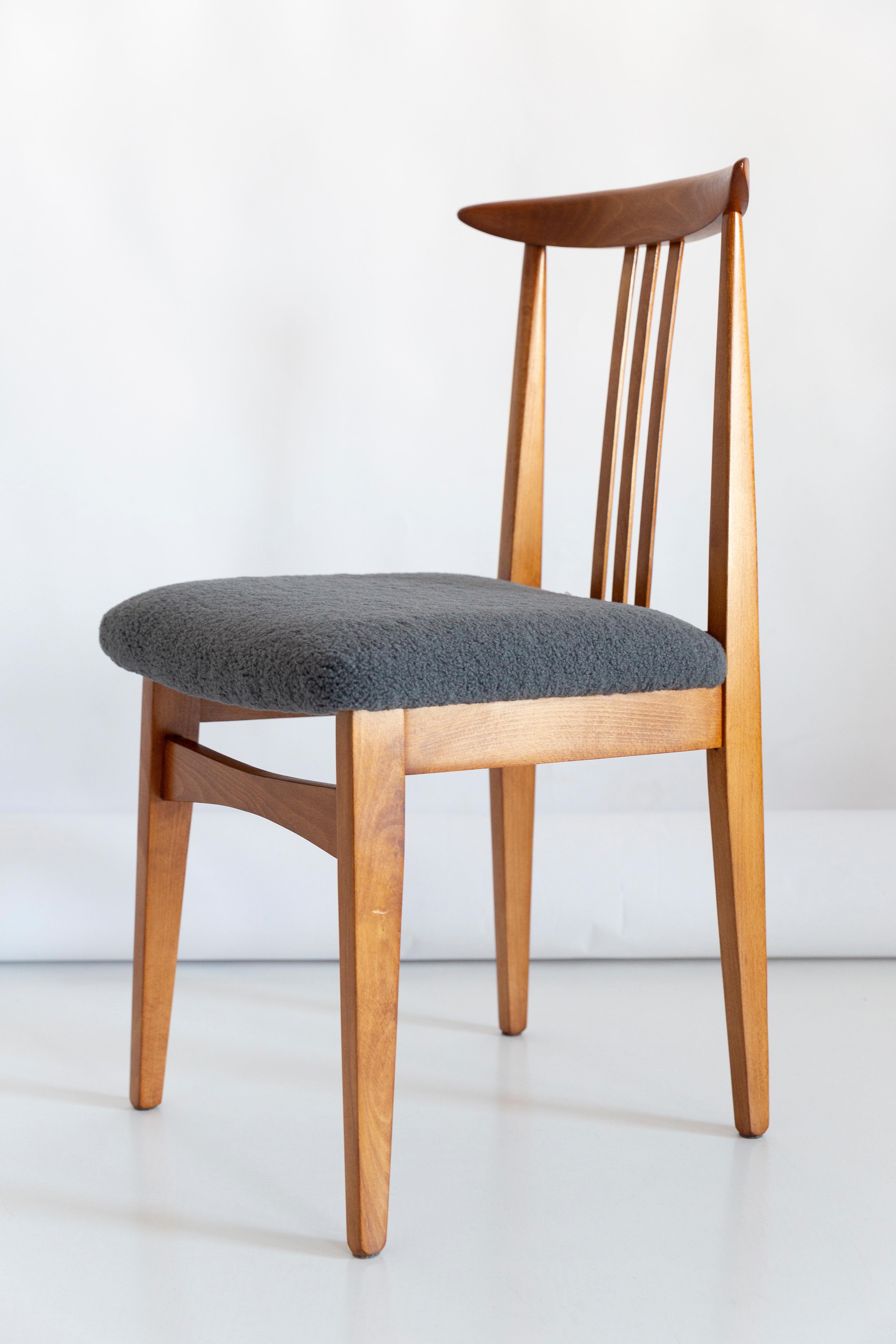 Set of ten beech chairs designed by M. Zielinski, type 200 / 100B. Manufactured by the Opole Furniture Industry Center at the end of the 1960s in Poland. The chairs have undergone a complete carpentry and upholstery renovation. Seats covered with