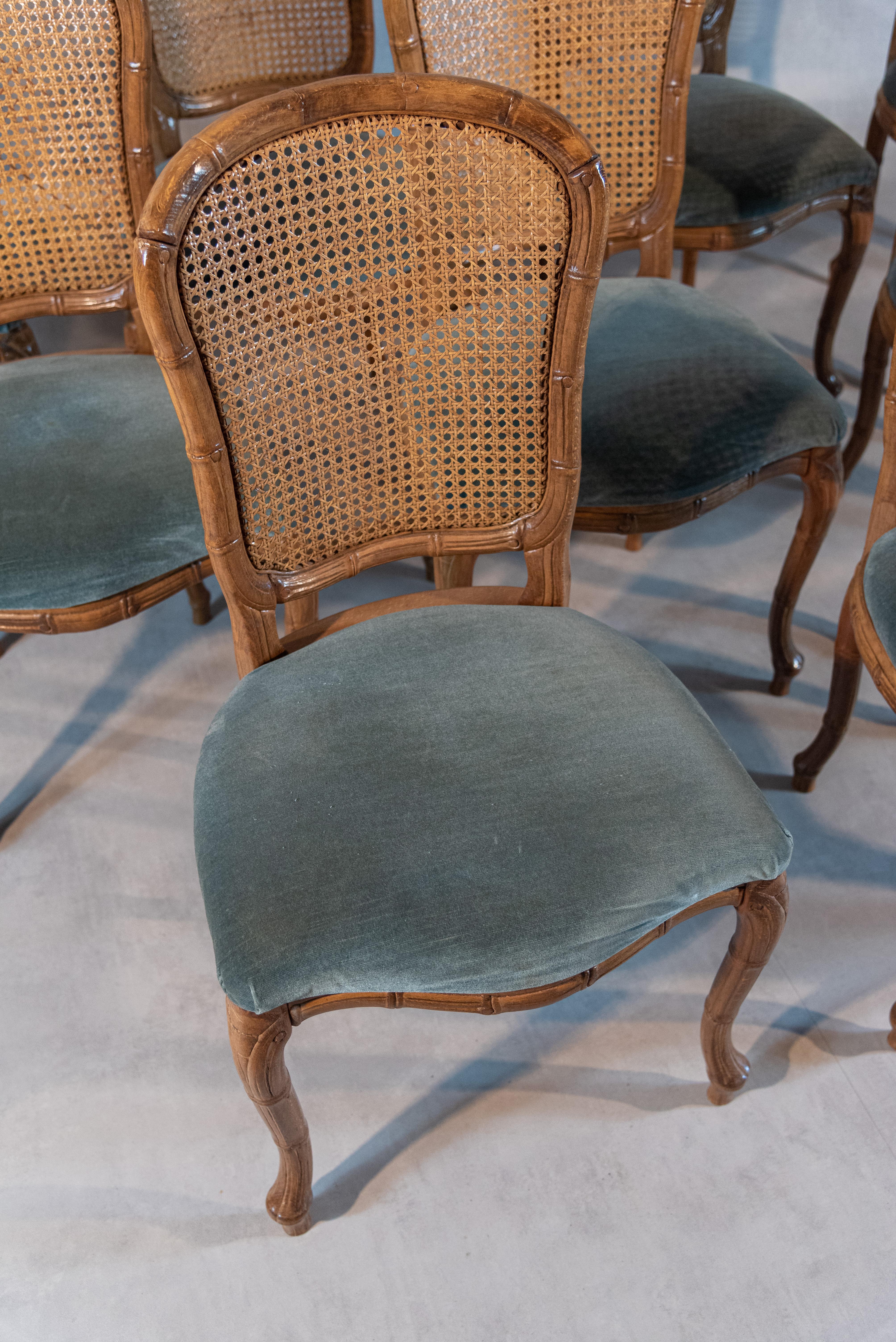 Elevate your dining experience with this exquisite set of ten midcentury caned chairs that effortlessly blend aesthetics with comfort. Crafted with meticulous attention to detail, the impressive cane work backrests showcase the artistry of finely