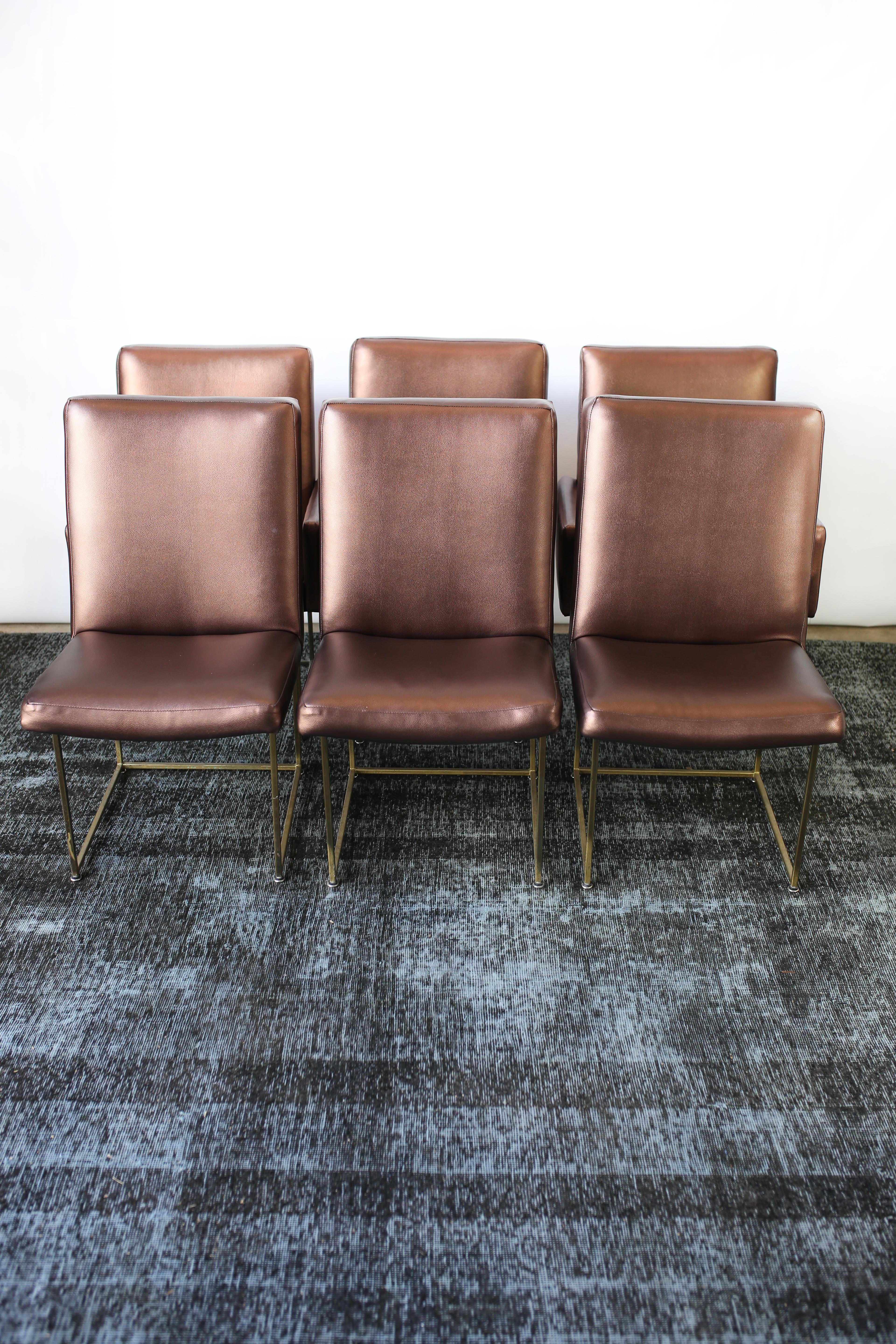 Milo Baughman was a modern furniture designer, with forward-thinking and distinctive American designs. This distinct set of ten Milo Baughman dining chairs are in overall good condition and wear consistent with age and use. Reupholstered in a