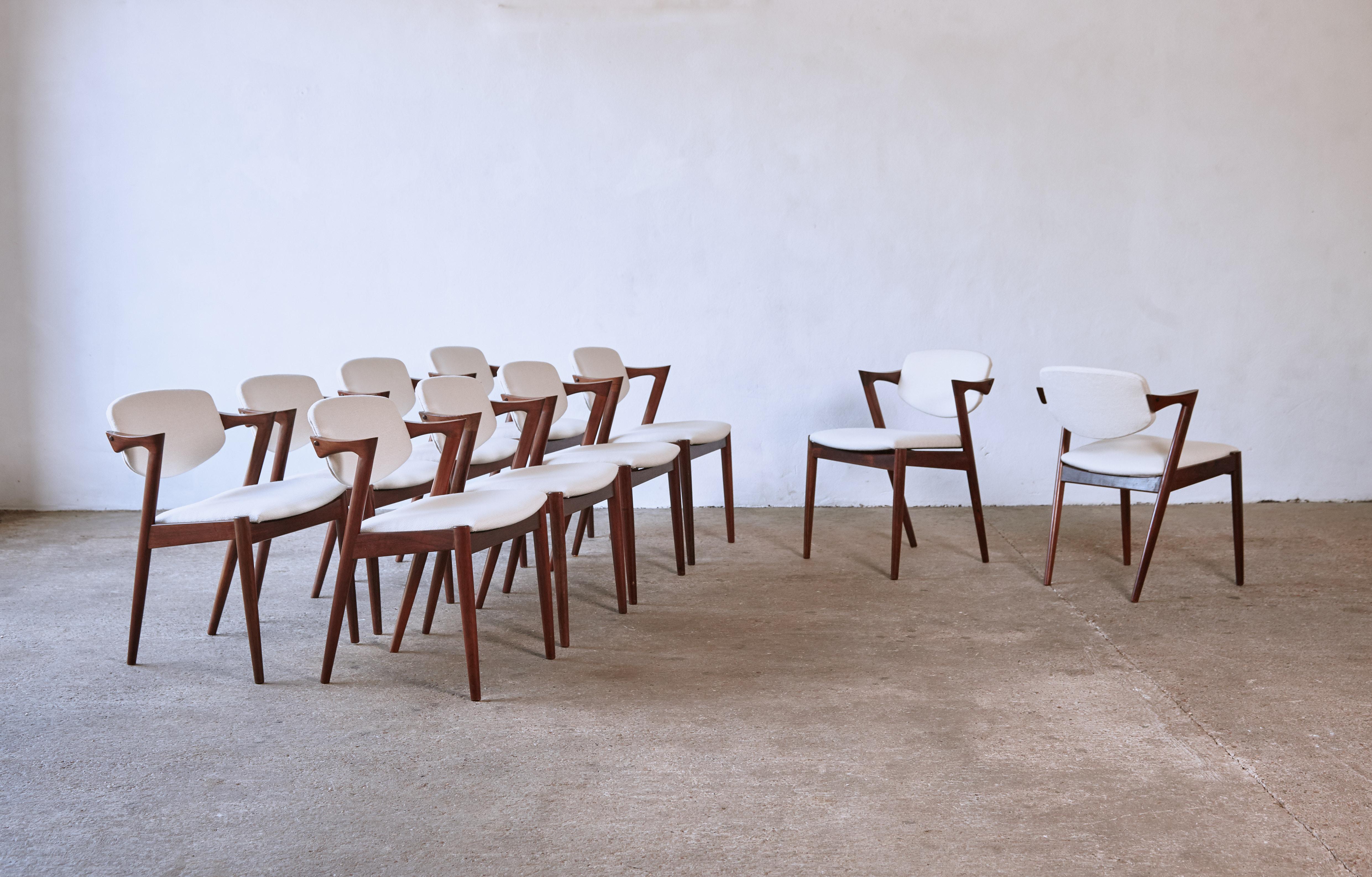 A set of ten (10) Model 42 rosewood dining chairs by Kai Kristiansen for Schou Andersen, Denmark, 1960s. Tilting backrest. Newly reupholstered seats in Larsen / Cowtan and Tout fabric. Very good condition, only one chair shows some wear on the