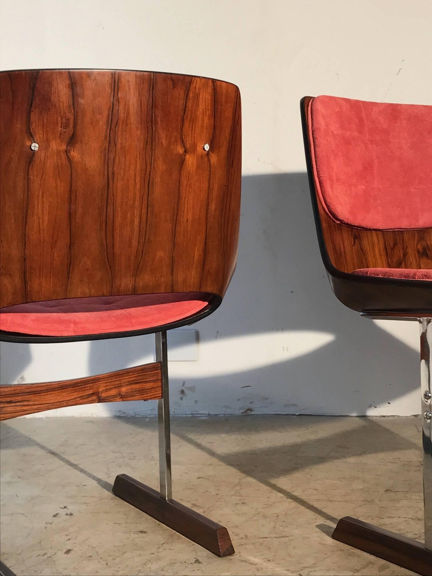 Set of ten Brazilian modern dining chairs made of rosewood with chromed metal details by Jorge Zalszupin. The legs are made of chromed metal with rosewood covering at its base. Leather upholstery covering was recently restored. Excellent restored